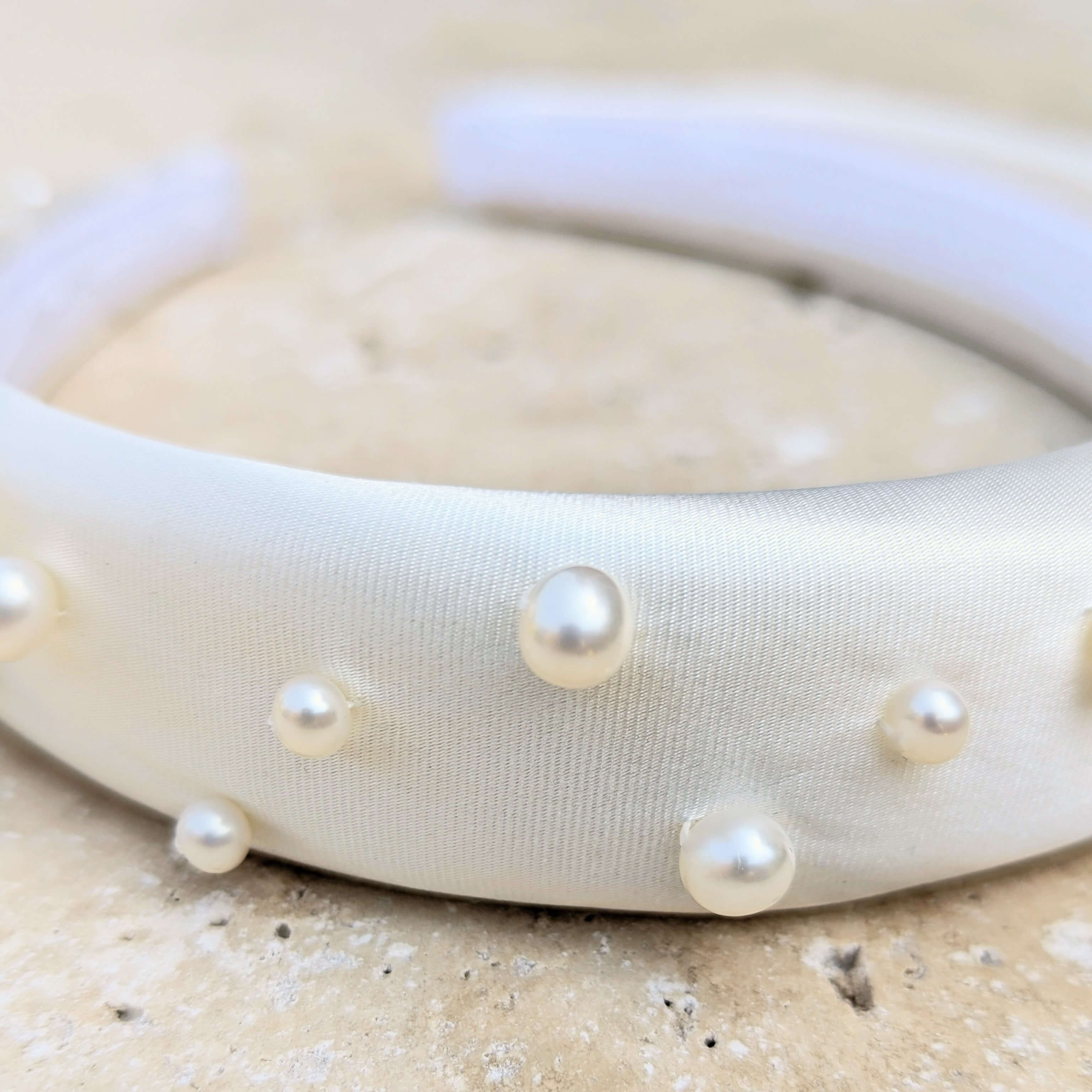 Closeup of real white bridal pearl headband
