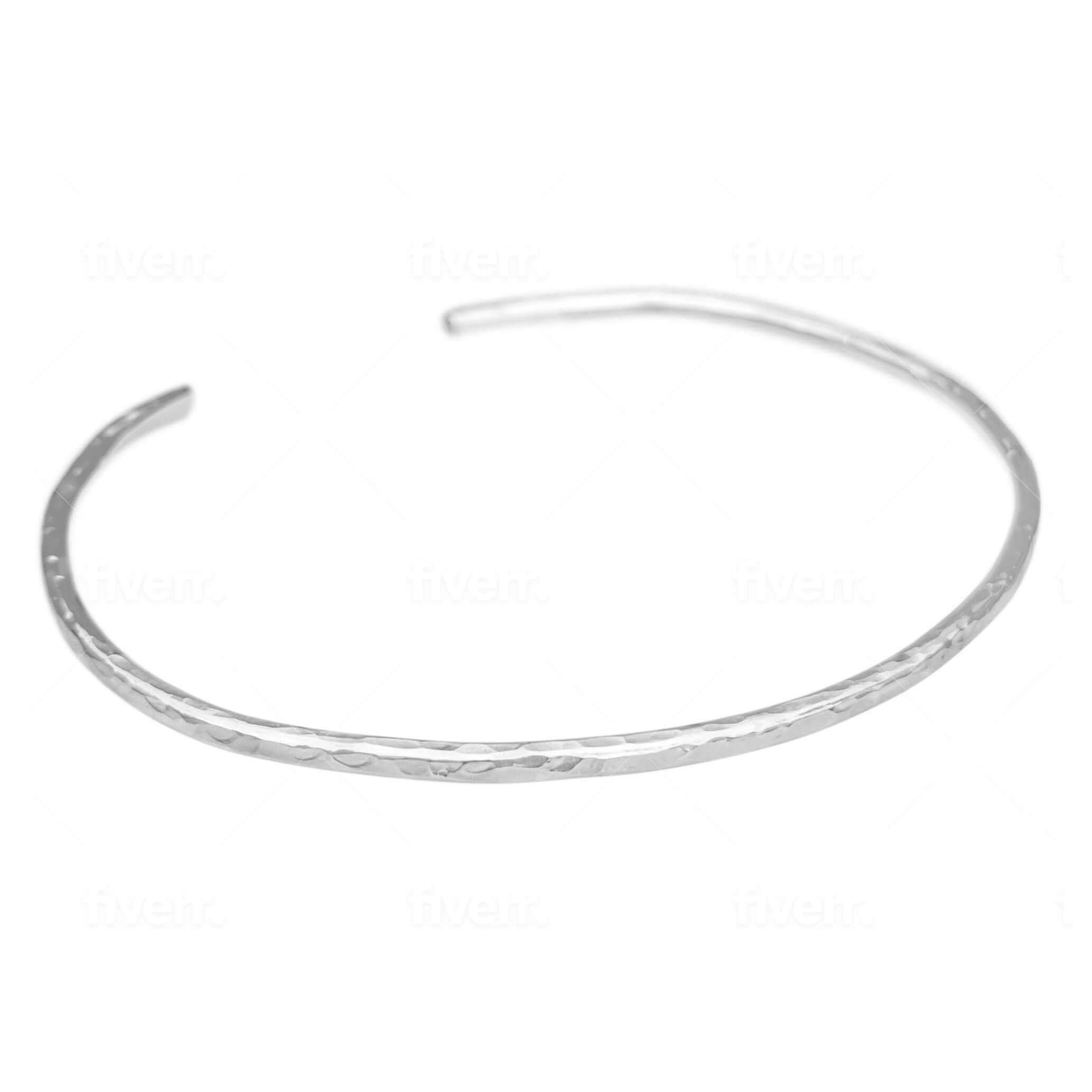 hammered cuff bracelet in sterling silver on a white background