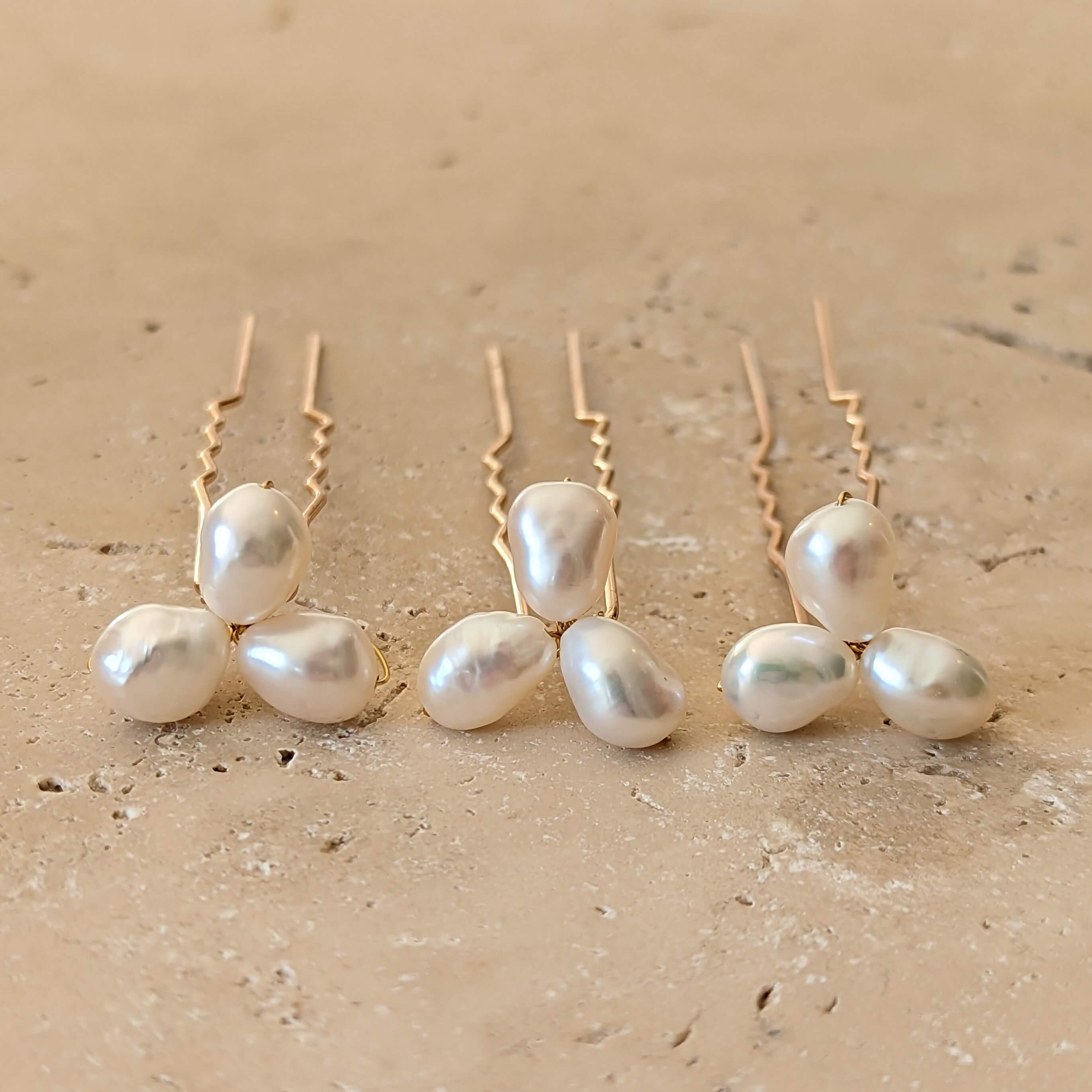 three medium pearl cluster hair pins gold