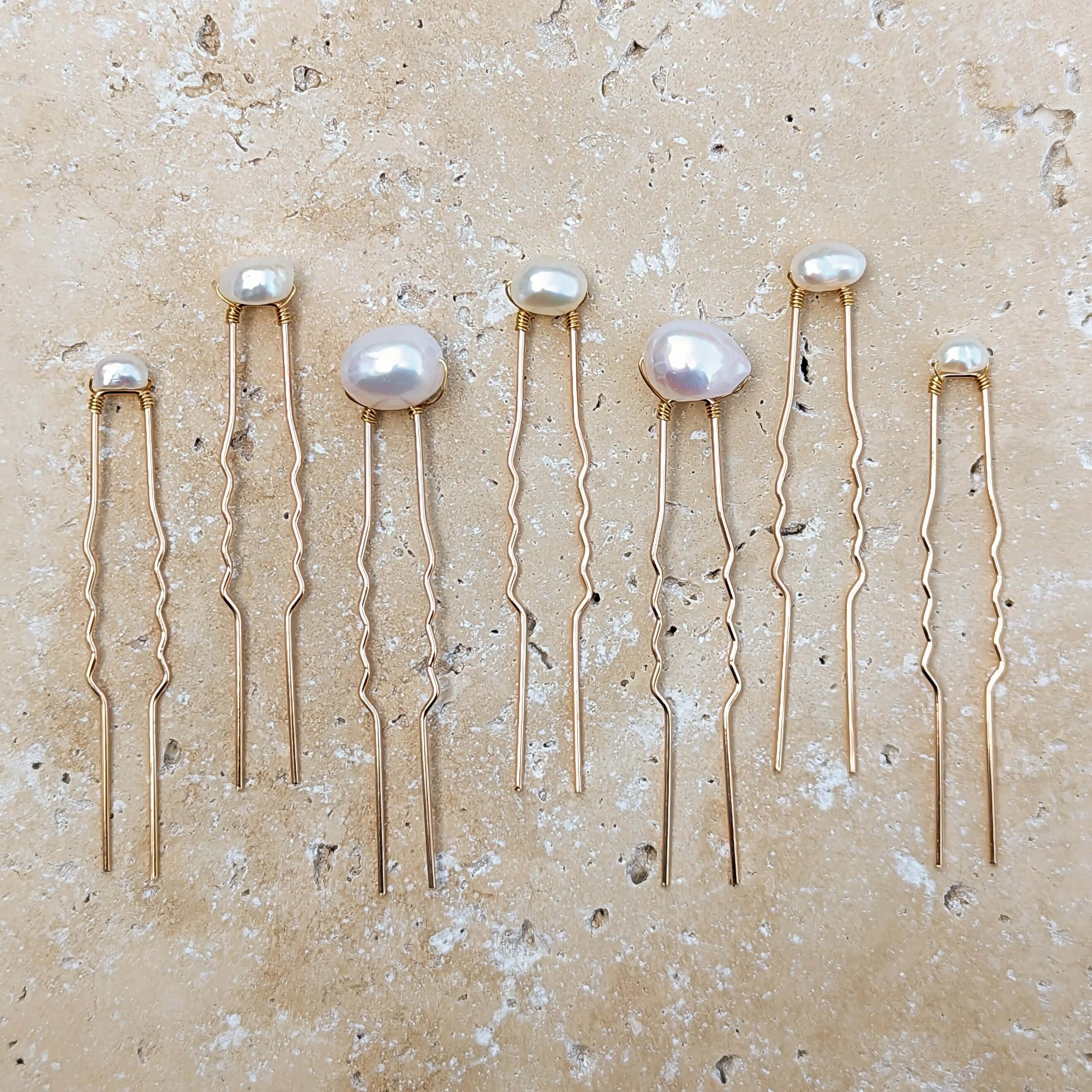 seven freshwater pearl gold hair pins in mixed sizes