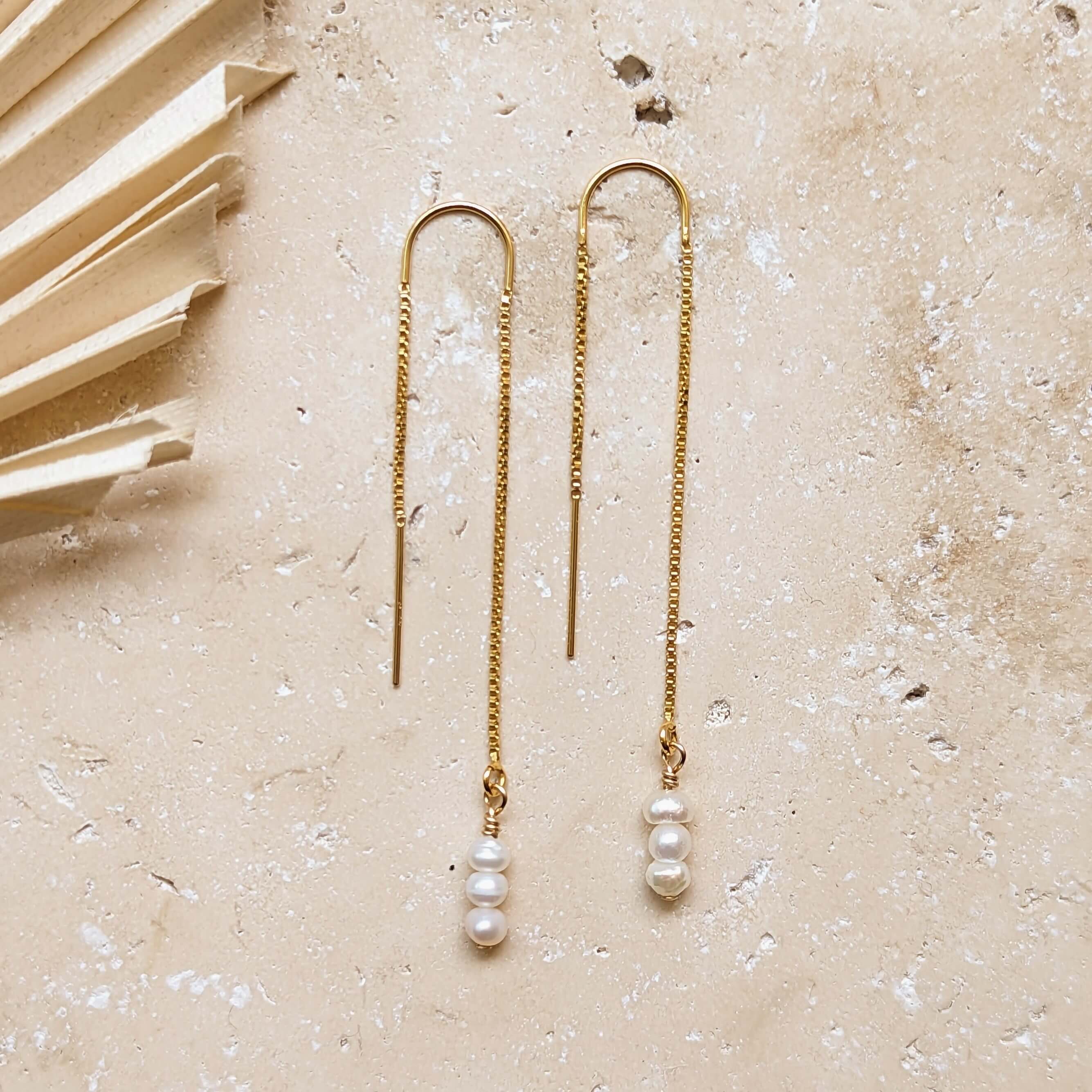 gold filled tiny pearl threader earrings flatlay