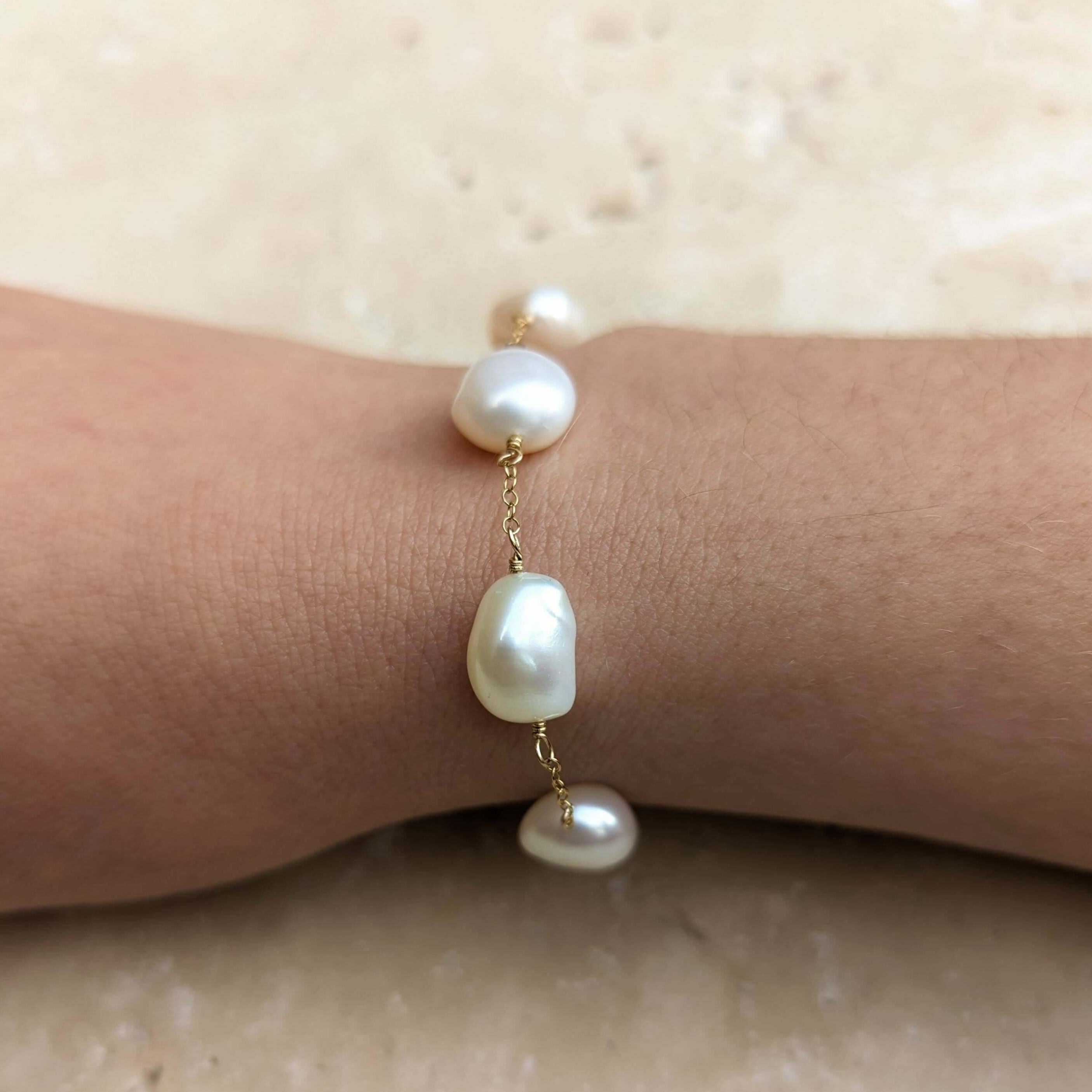 Pearl chain bracelet on model wrist in gold filled