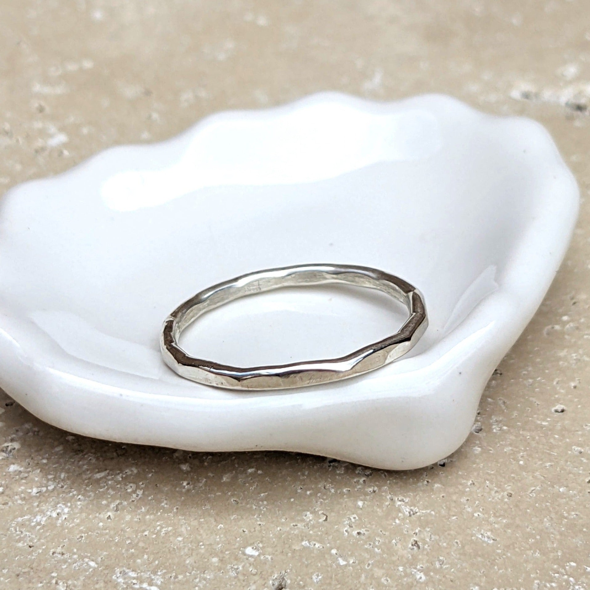 Sterling silver slim hammered ring in trinket dish