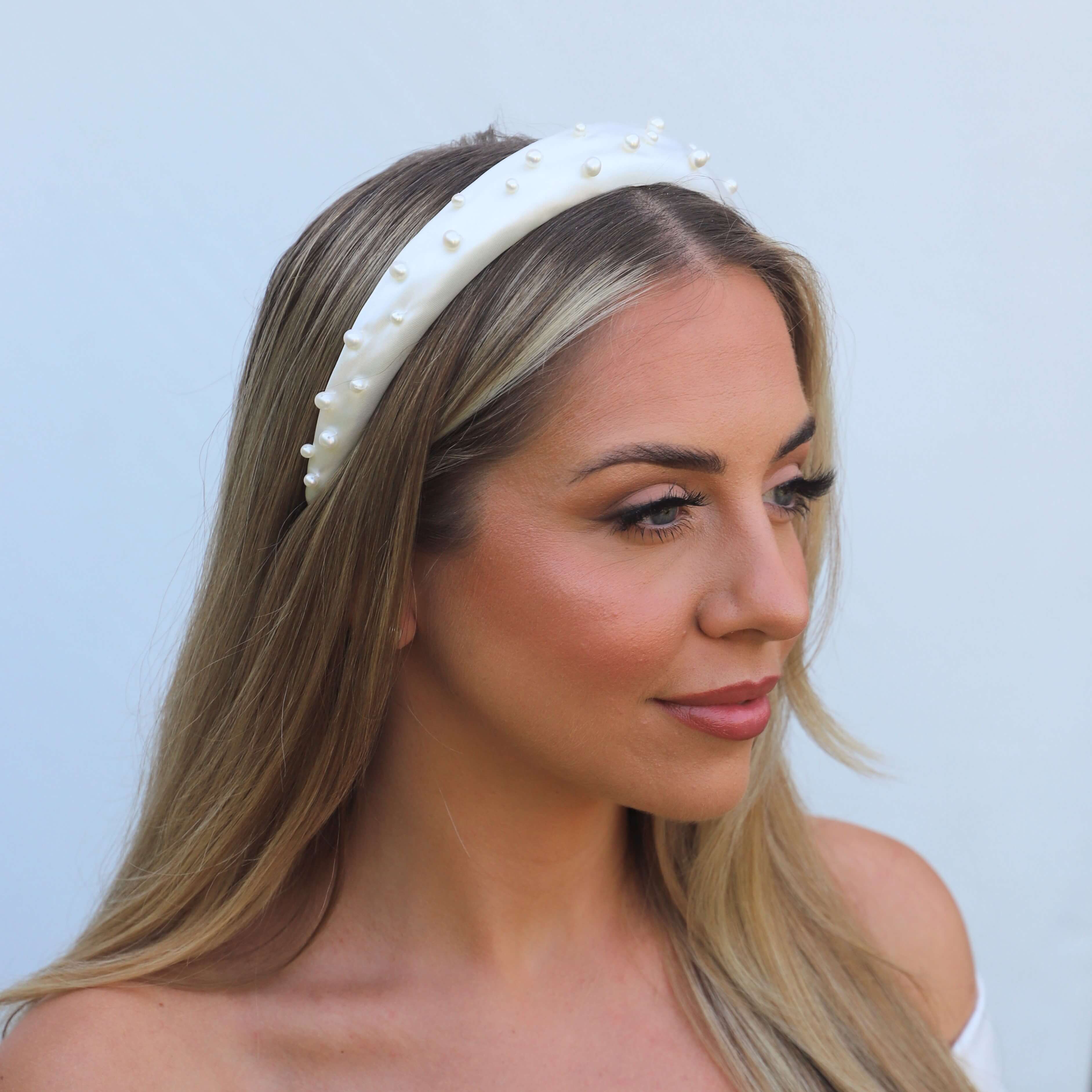 Model wearing a thick pearl headband