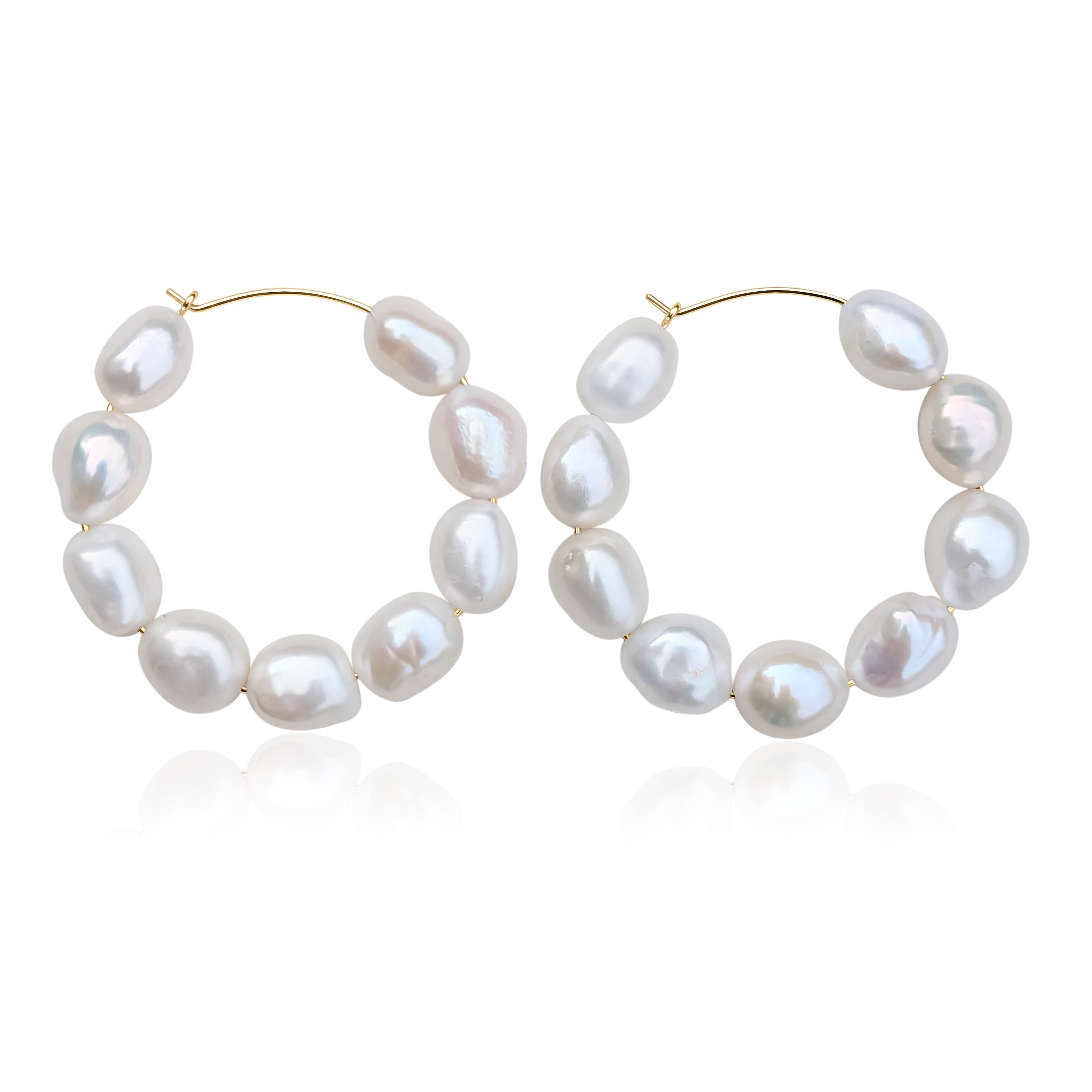 large pearl hoop earrings in gold filled on white background