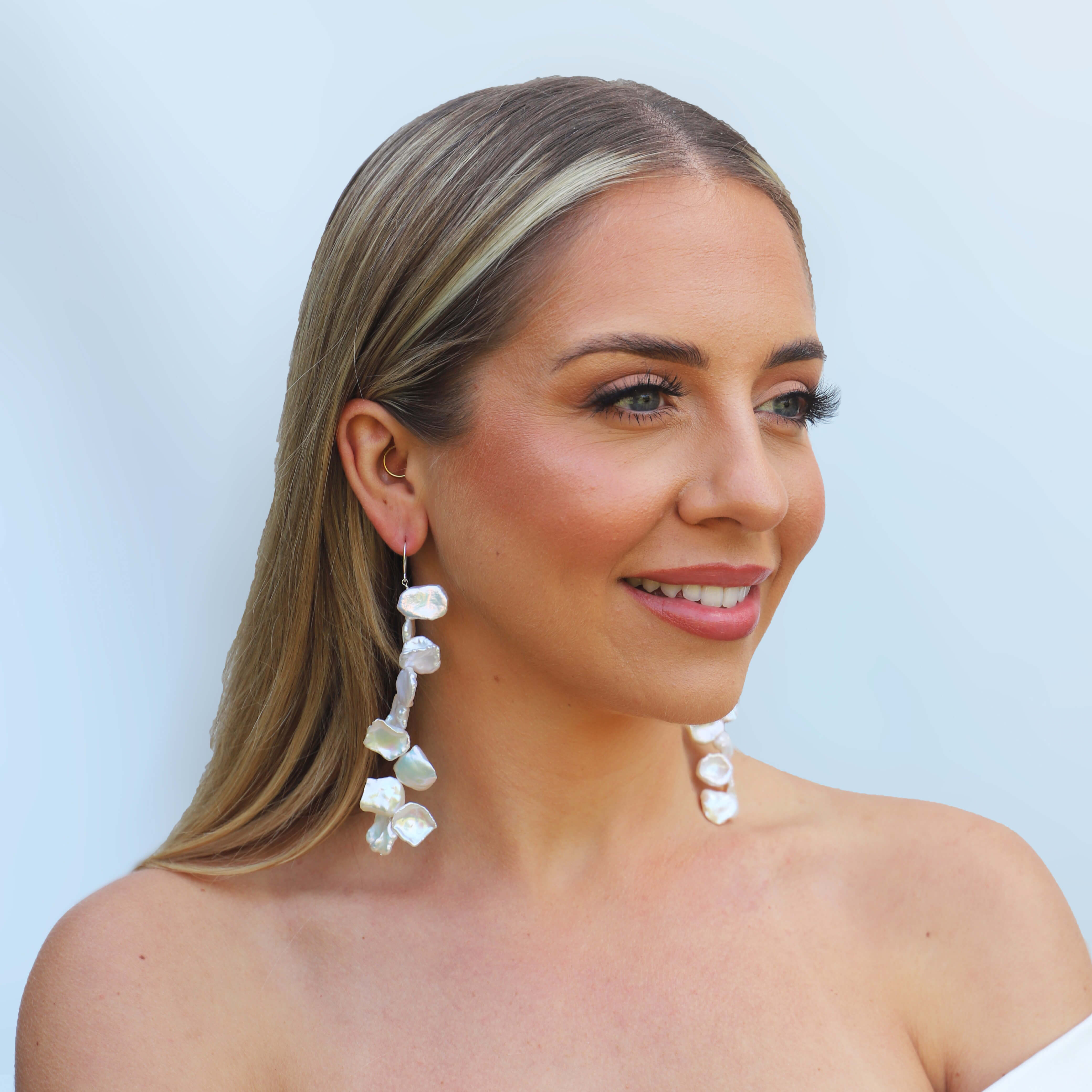 sterling silver long keshi pearl earrings on model