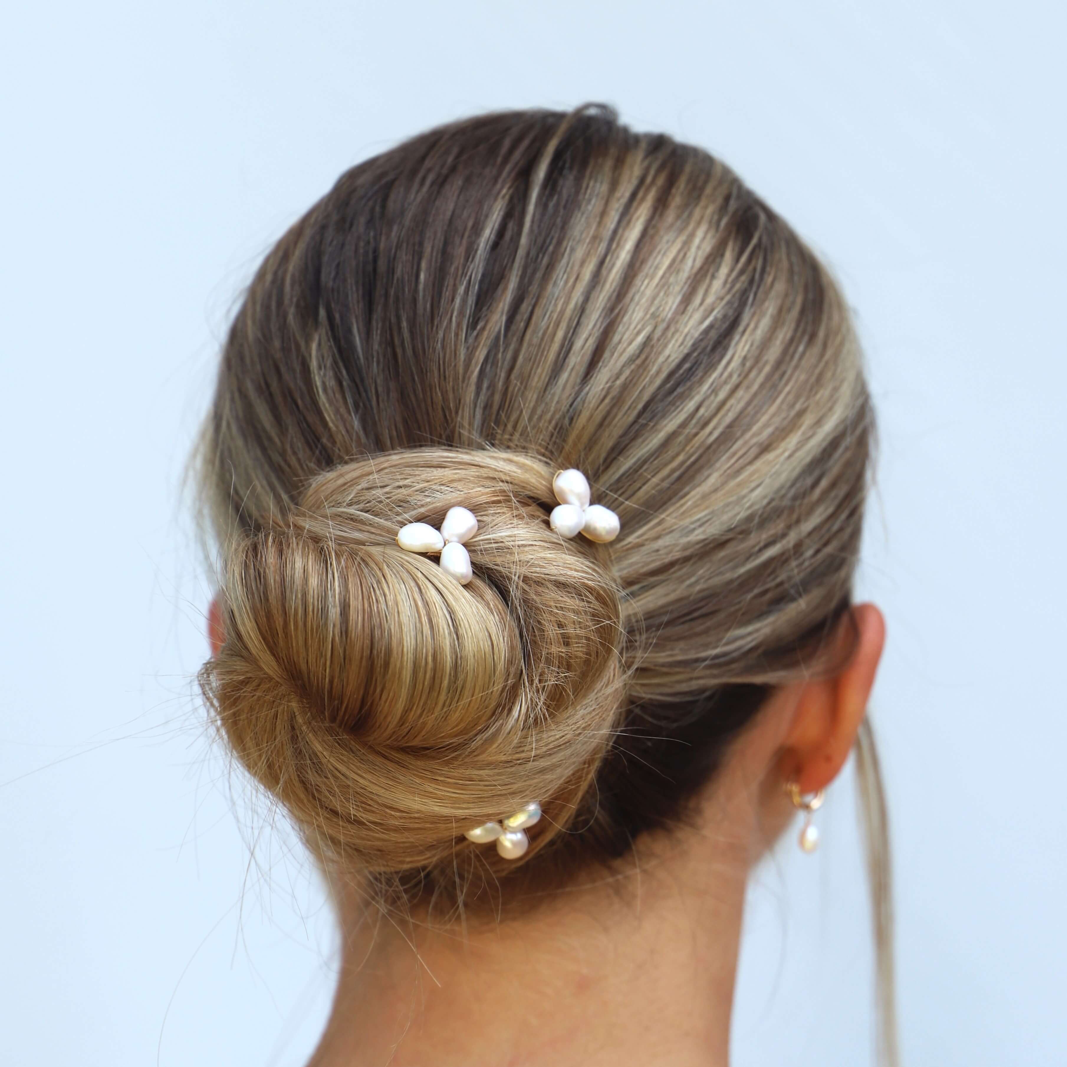 medium pearl cluster hair pins on model close up