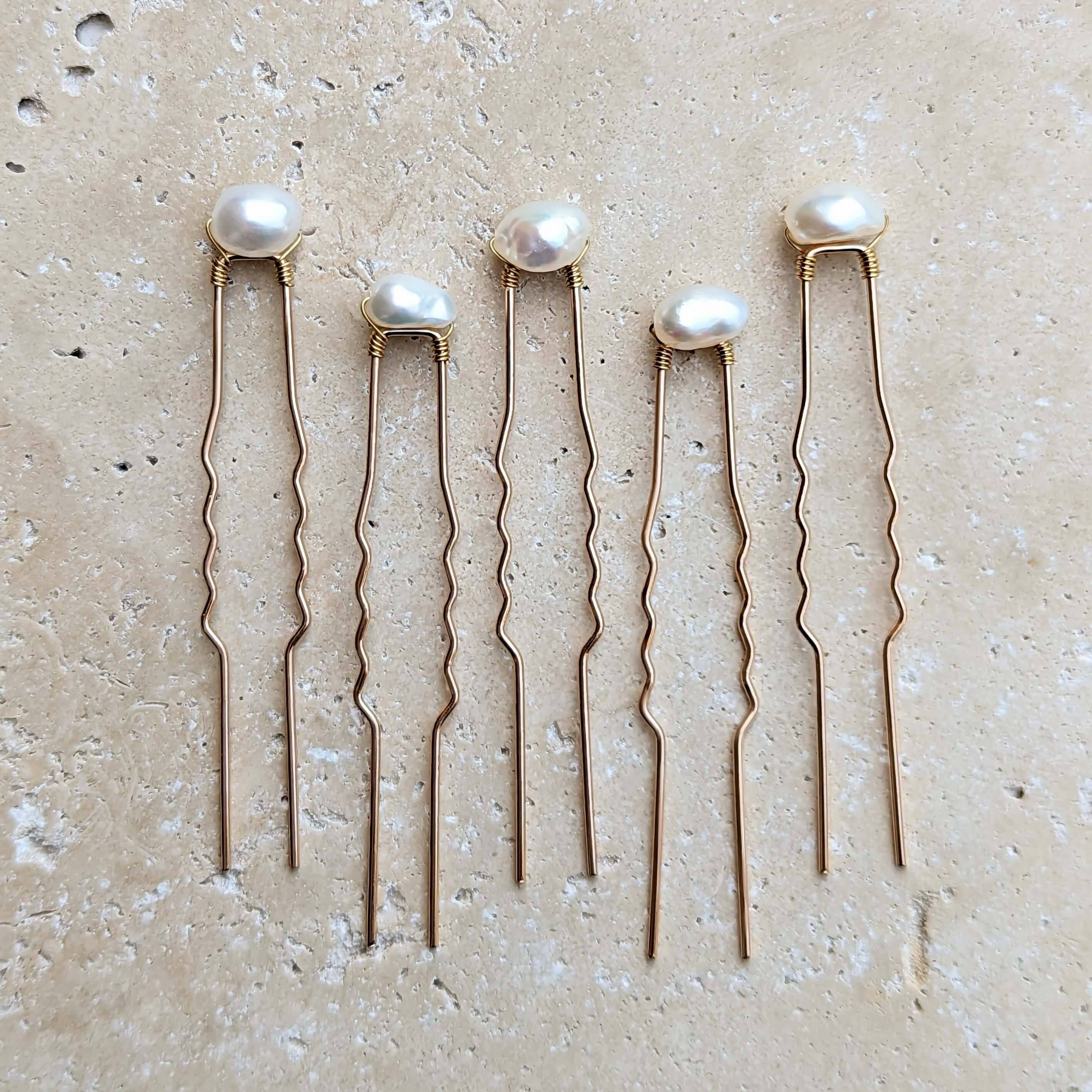 5 mid sized real baroque pearls on gold coloured hair pins