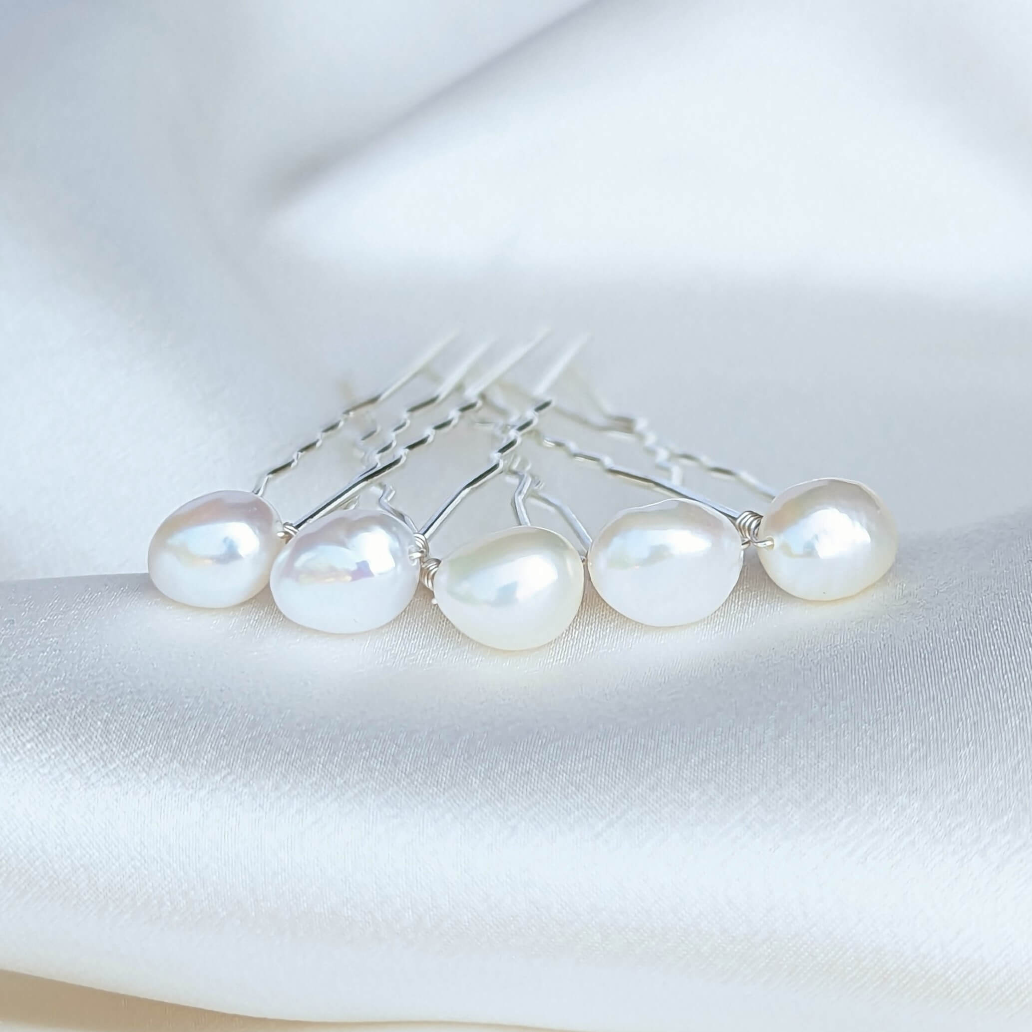 set of 5 mid sized real baroque pearls on silver coloured hair pins