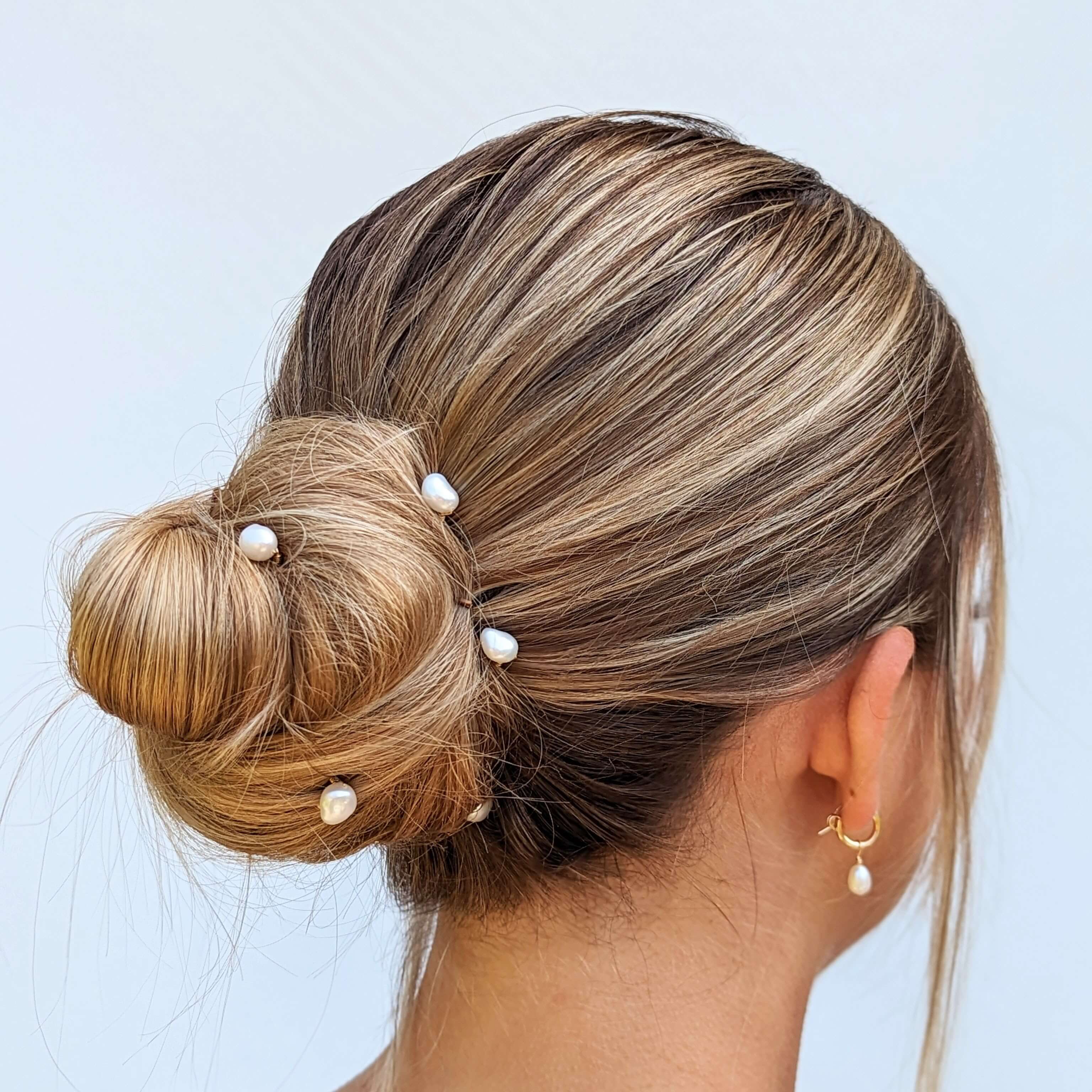 Bride wearing medium sized real pearl hair pins