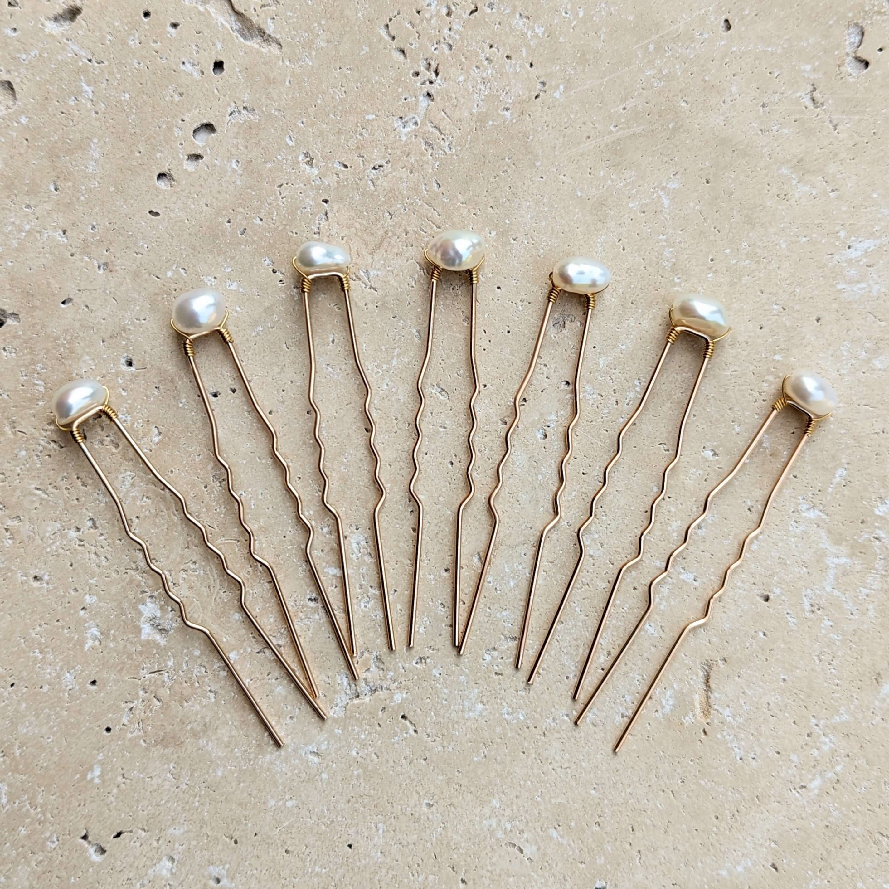 set of seven real freshwater pearls on gold coloured hair pins