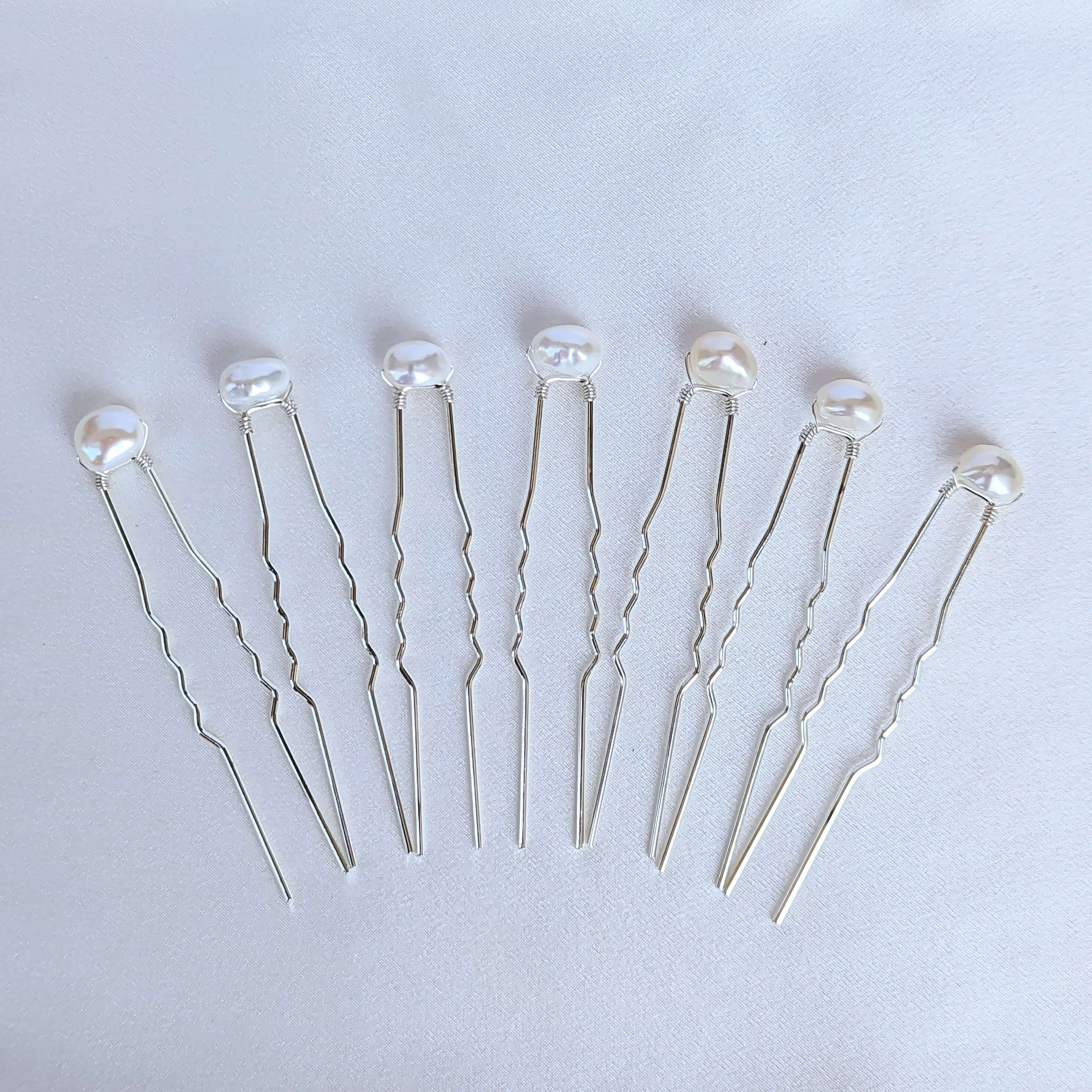 set of 7 medium sized real freshwater pearls on silver coloured hair pins