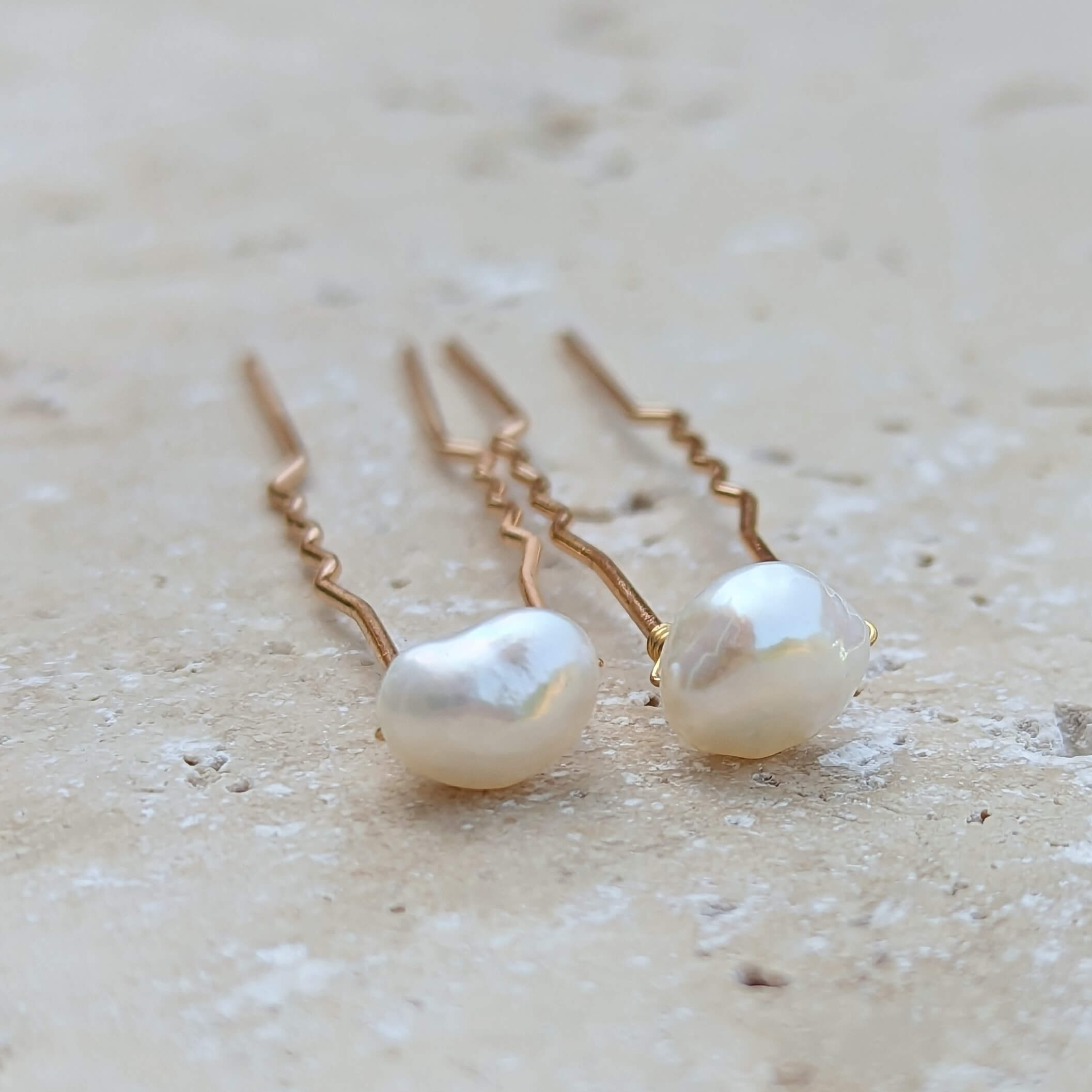 two mid sized real freshwater pearls on gold coloured hair pins