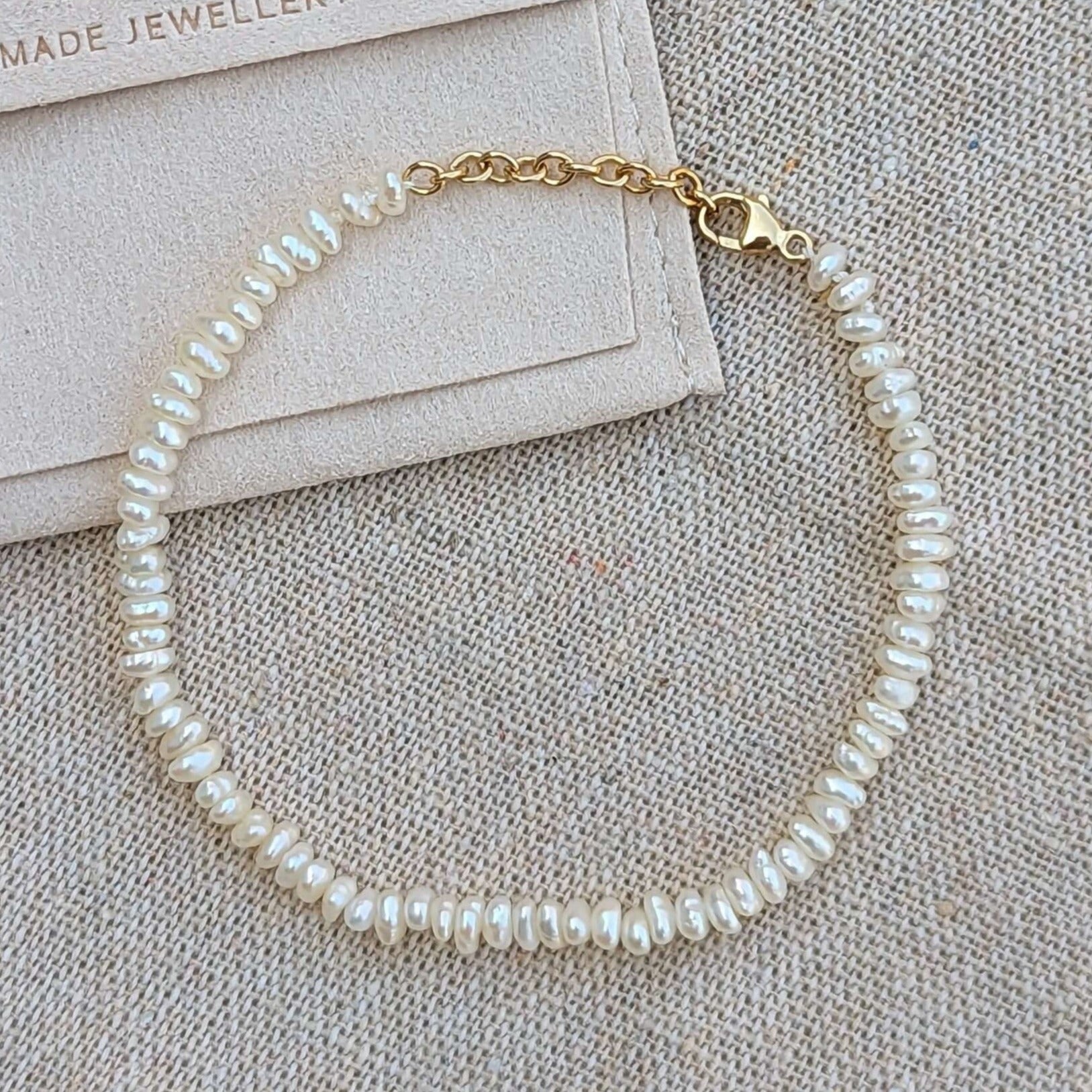 mini freshwater pearl bracelet in gold filled flatlay