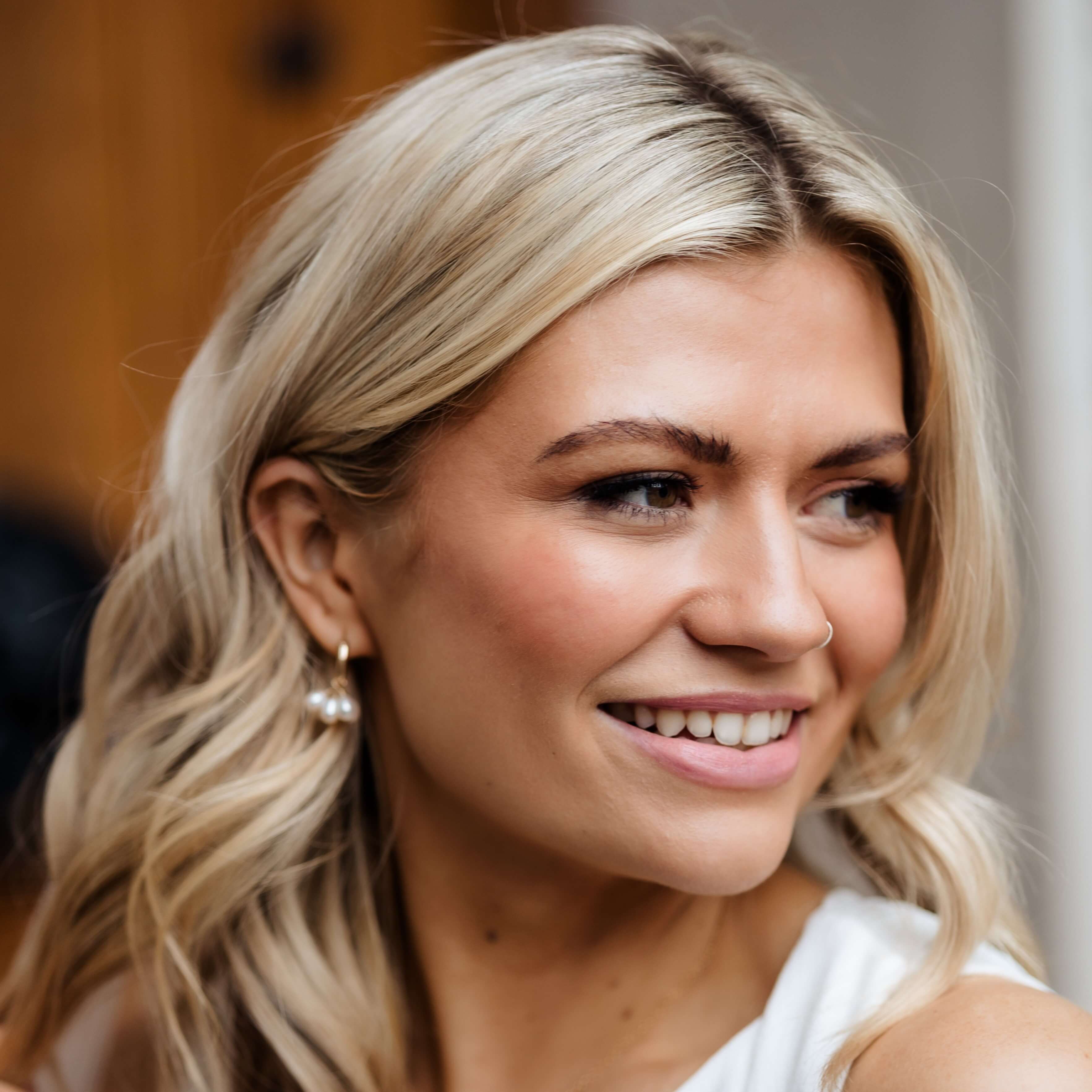 pearl cluster hoop earrings on blonde model