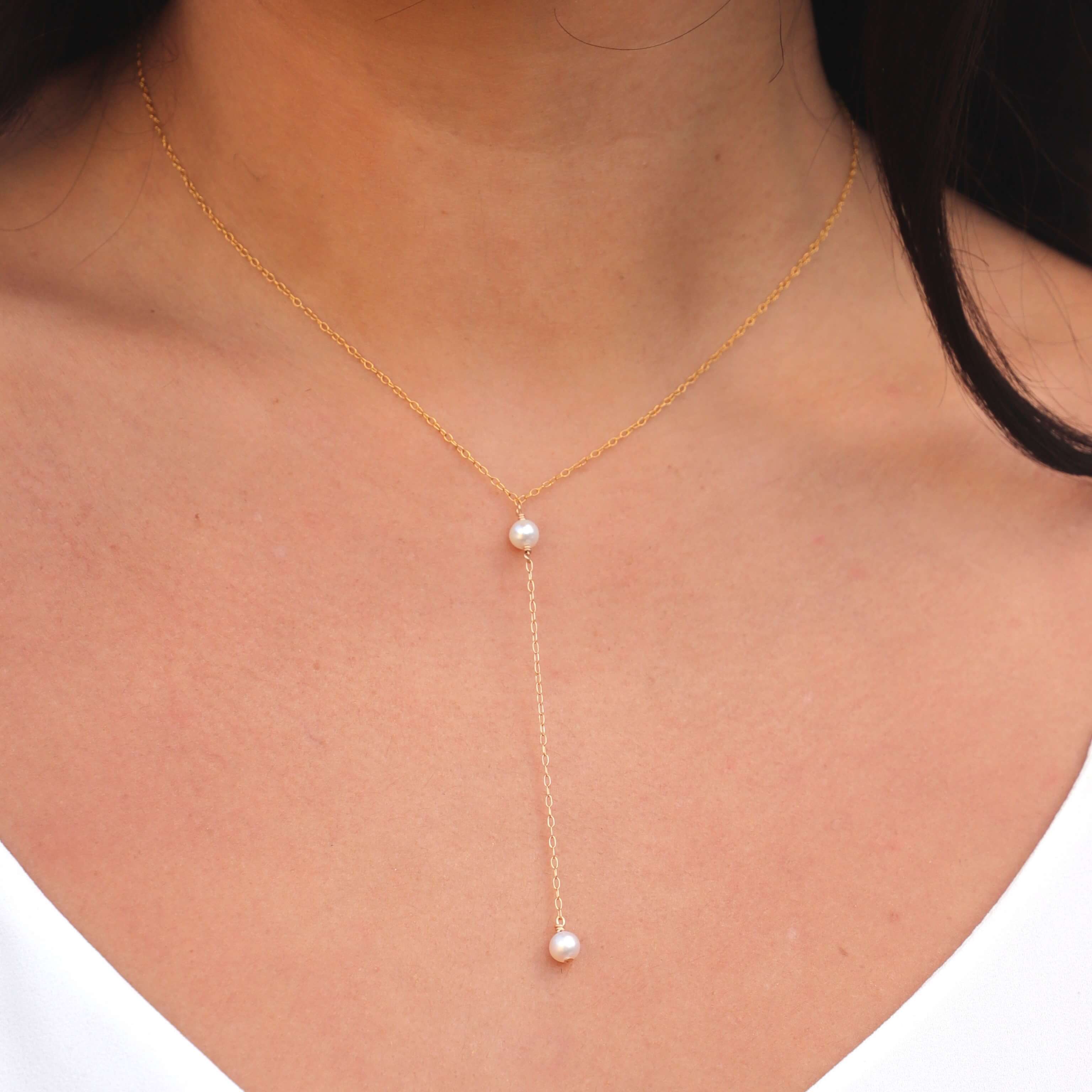gold filled pearl chain necklace close up on model