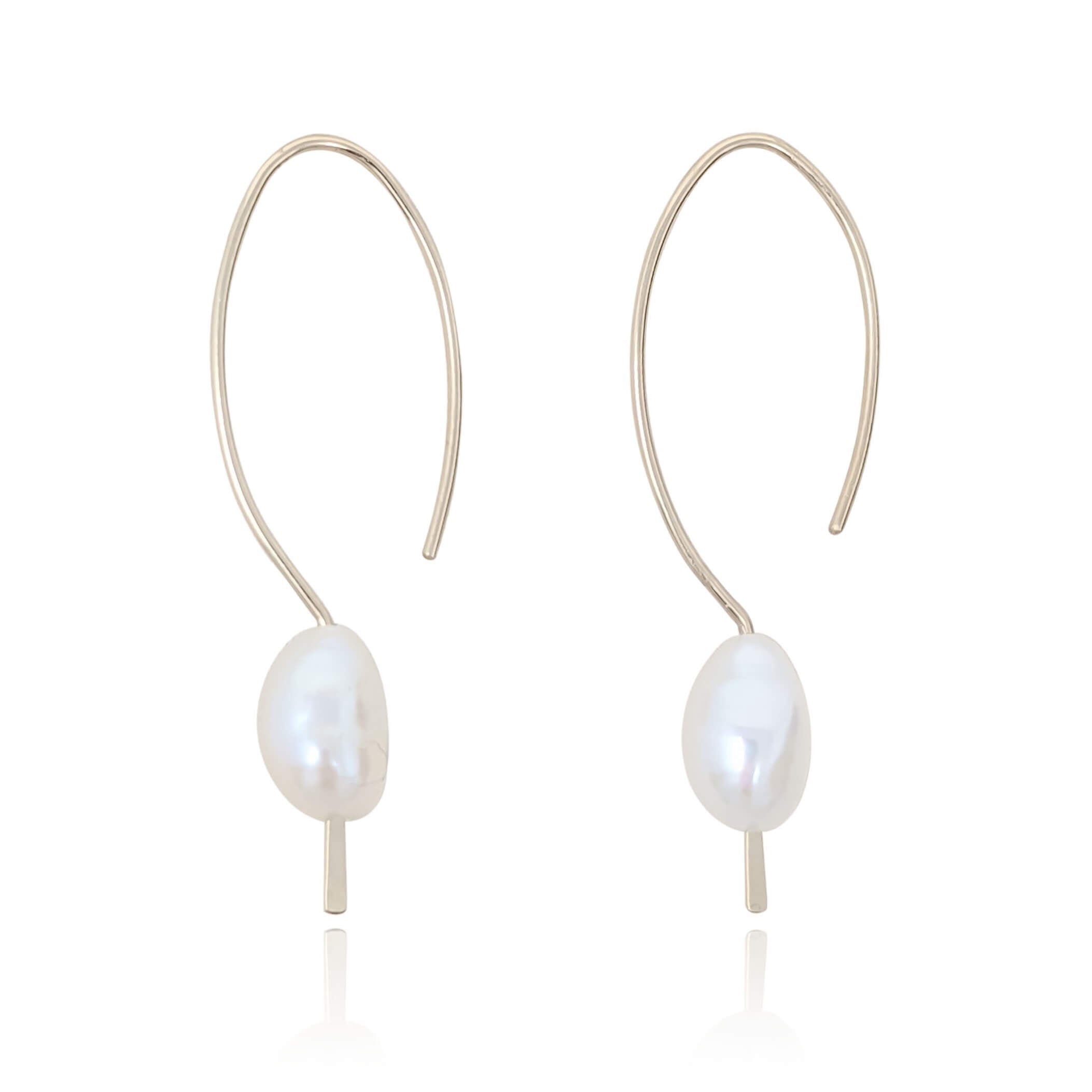 gold filled pearl pull through earrings on a white background