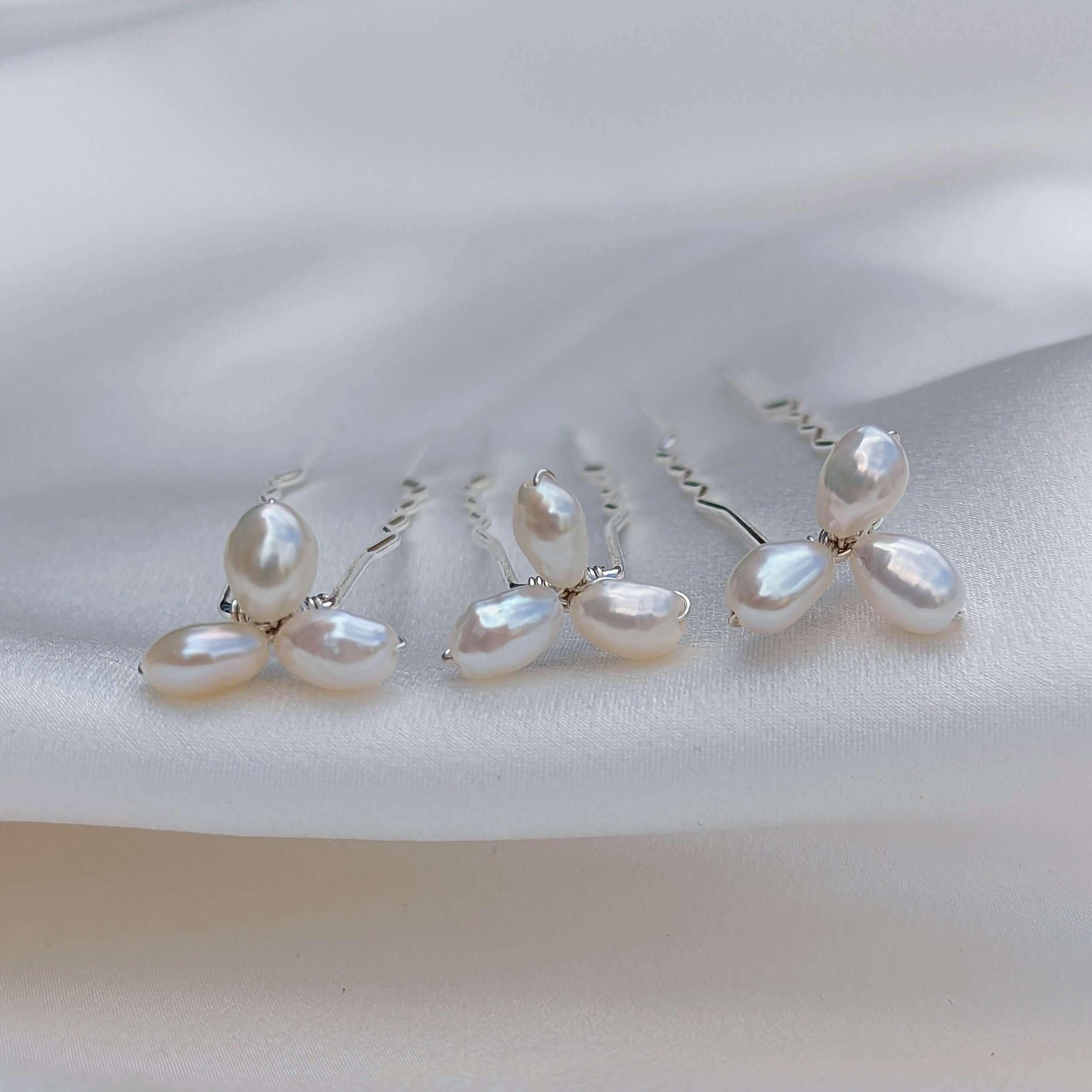 three small pearl cluster hair pins in silver