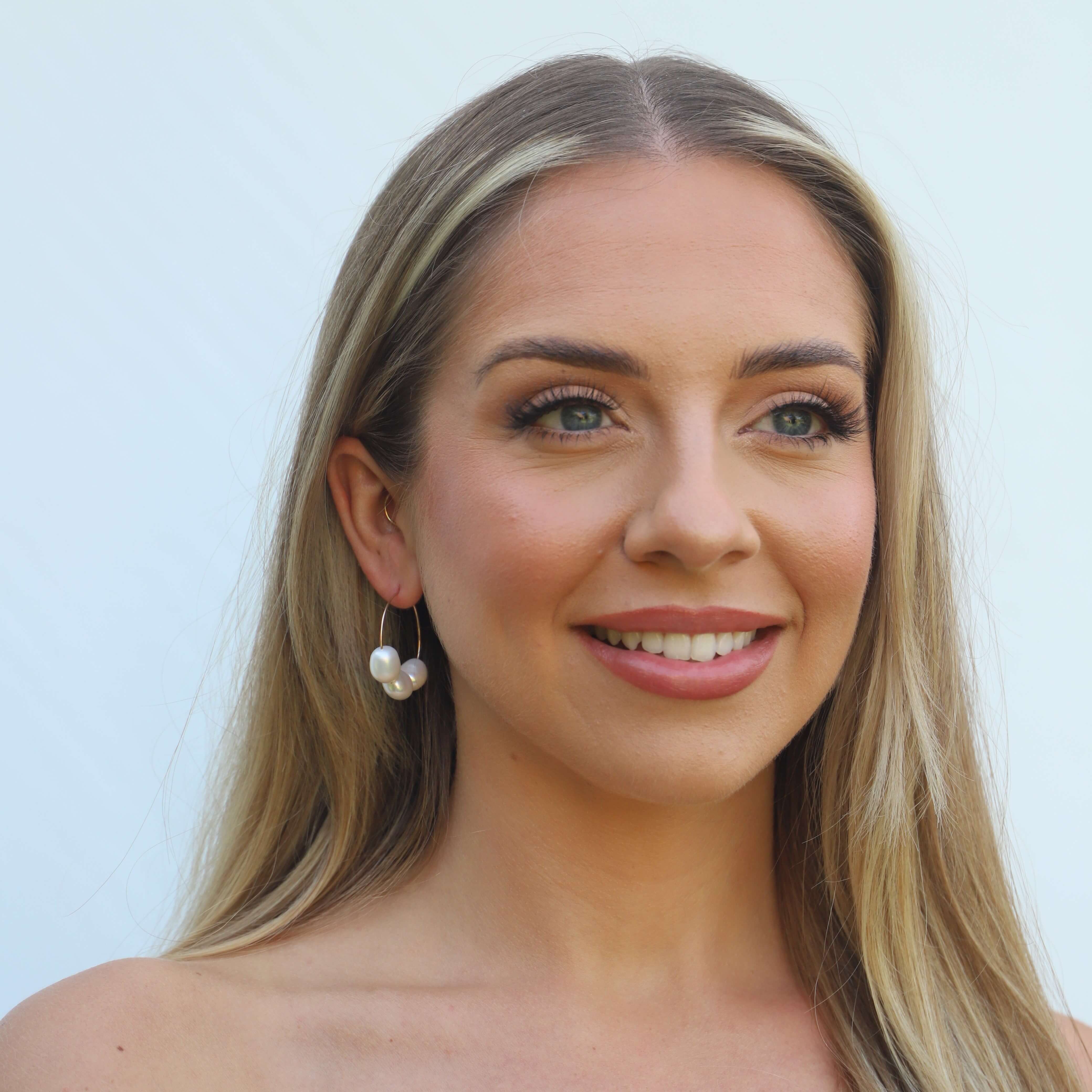 gold filled three pearl hoop earrings on model