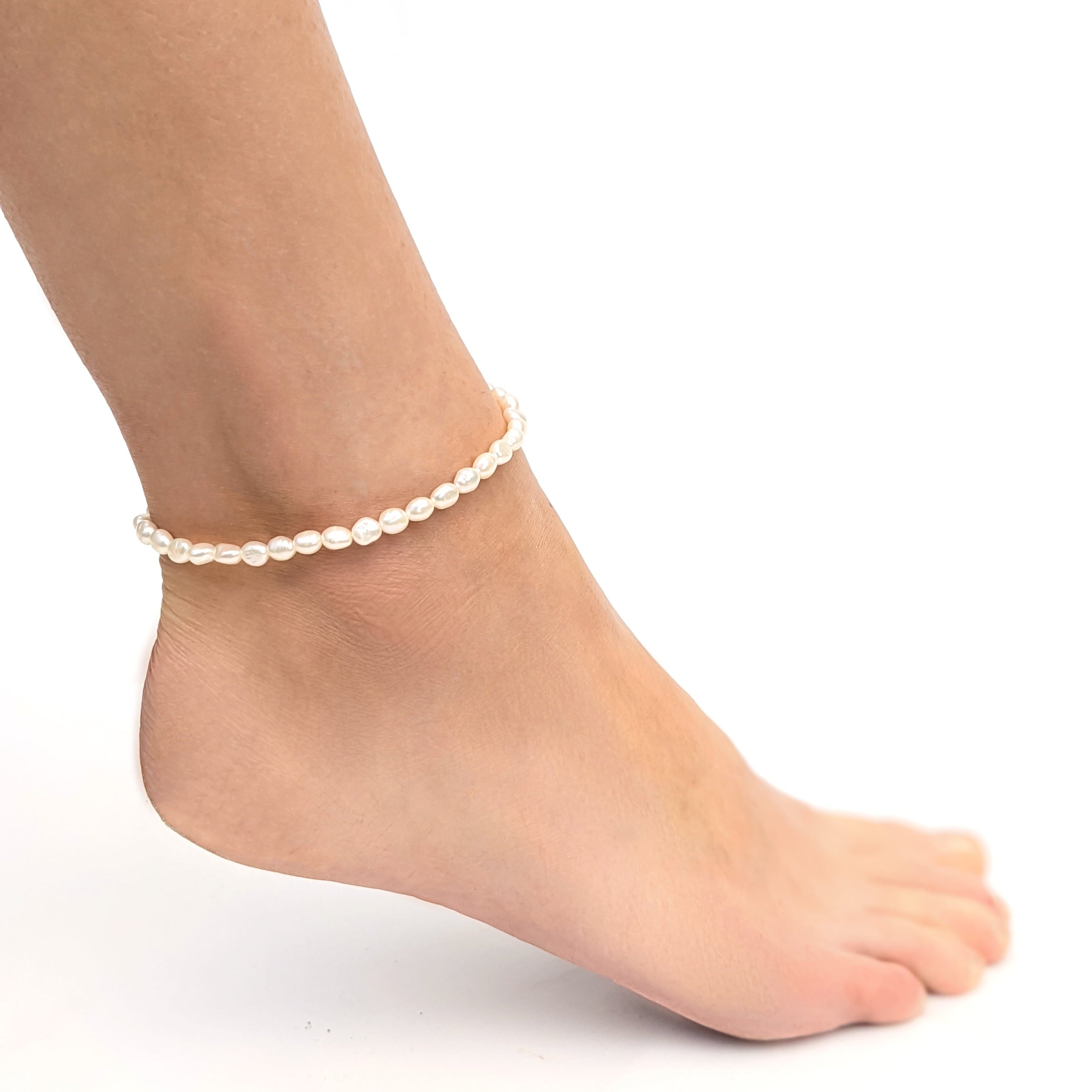 small freshwater pearl anklet on a bare ankle