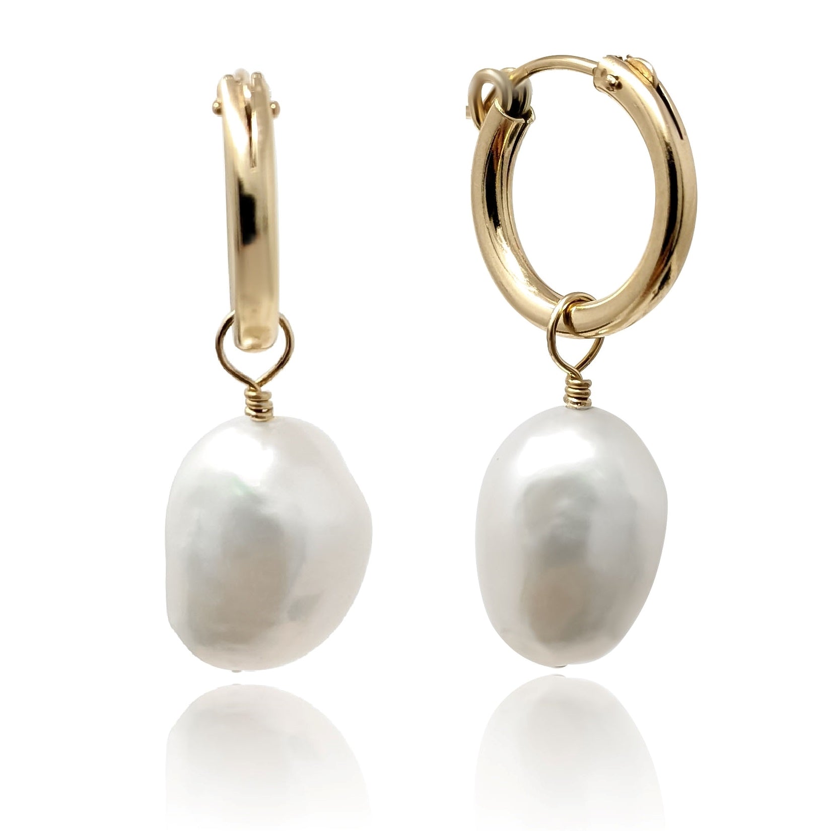 Gold filled hoop earring with baroque pearl pendant white background