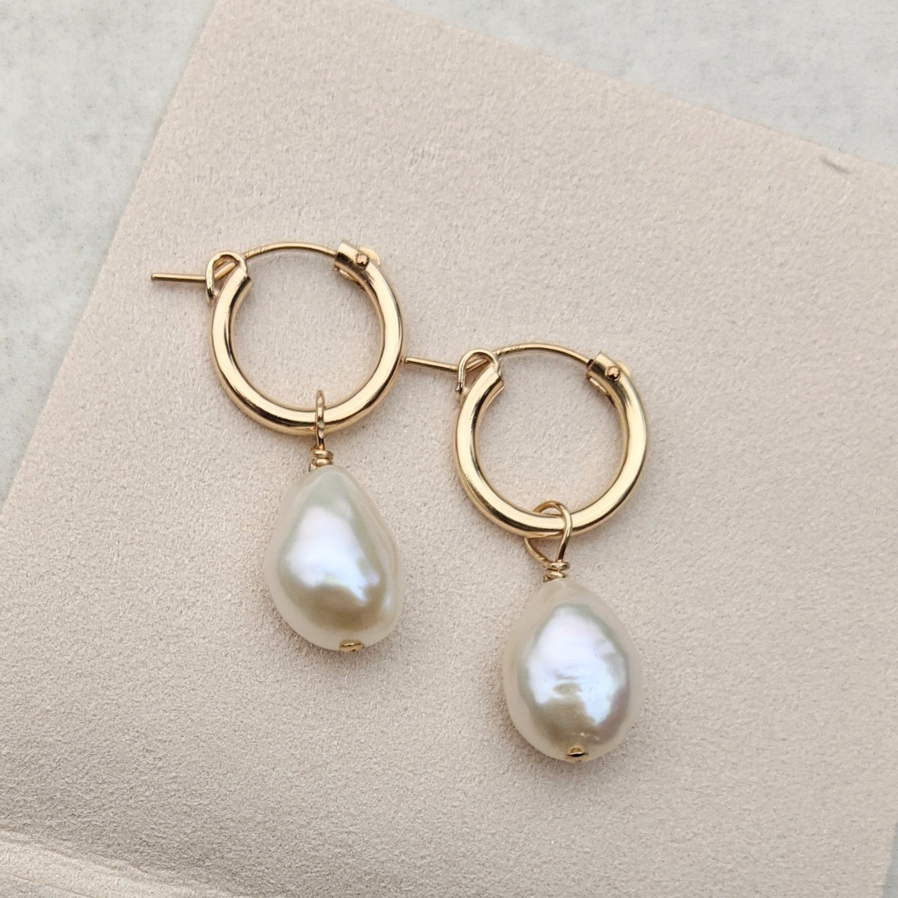 Gold filled hoop earring with baroque pearl pendant