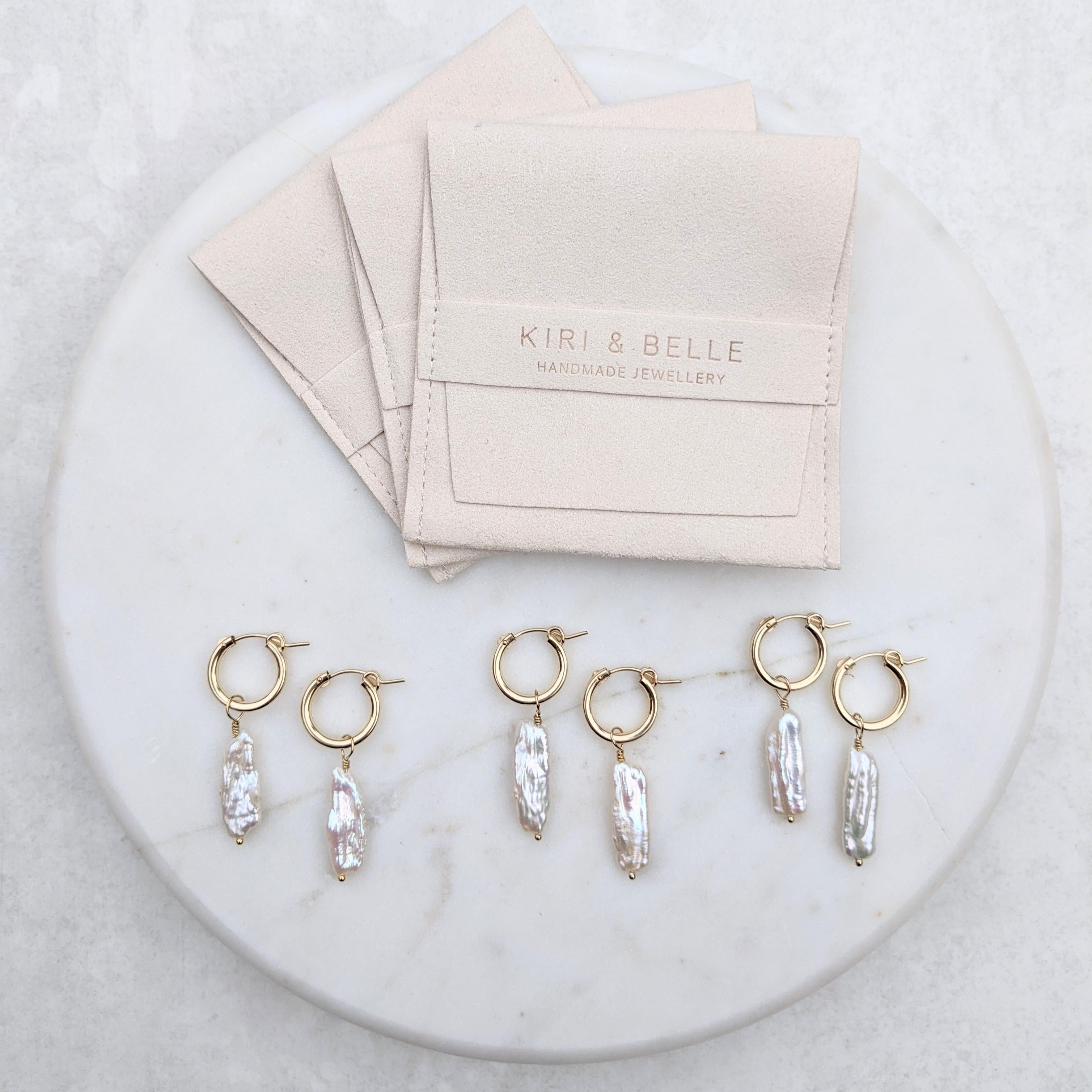 Biwa pearl gold hoop earrings with soft storage pouches