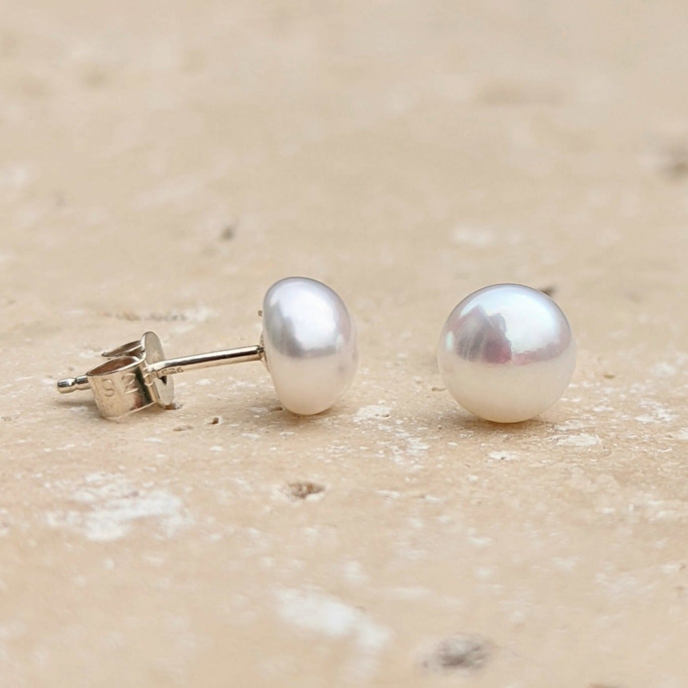 Pair of sterling silver white button pearl stud earrings