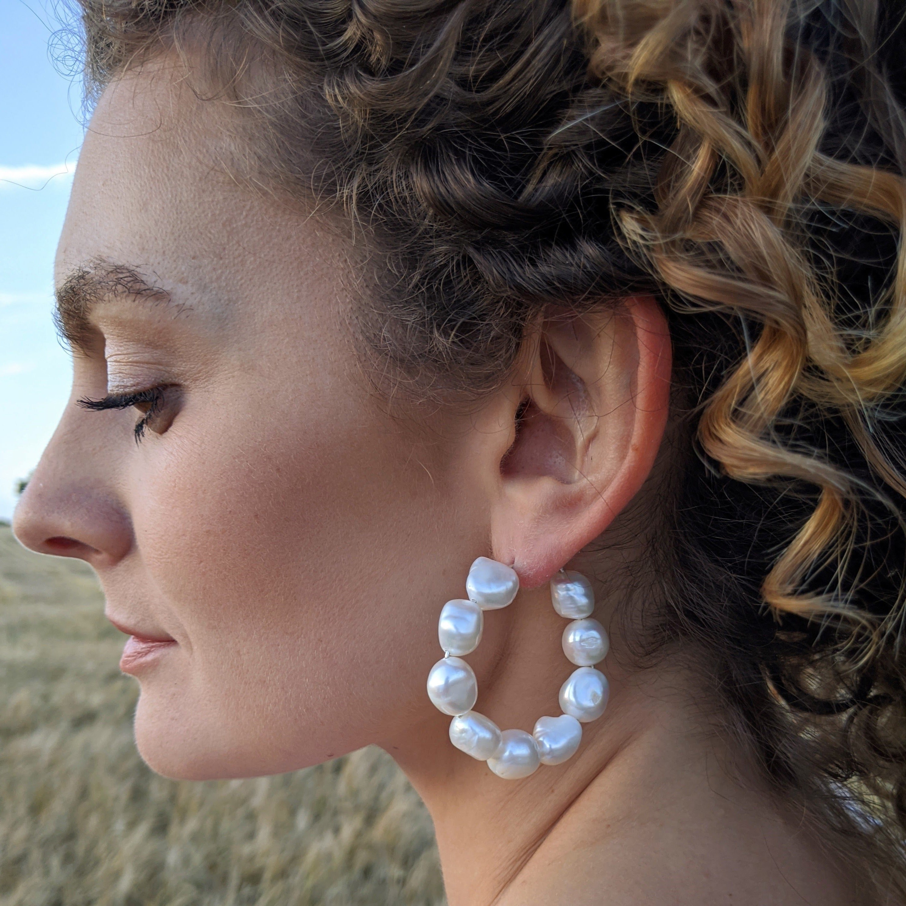 9 cultured baroque pearls on hoop earring