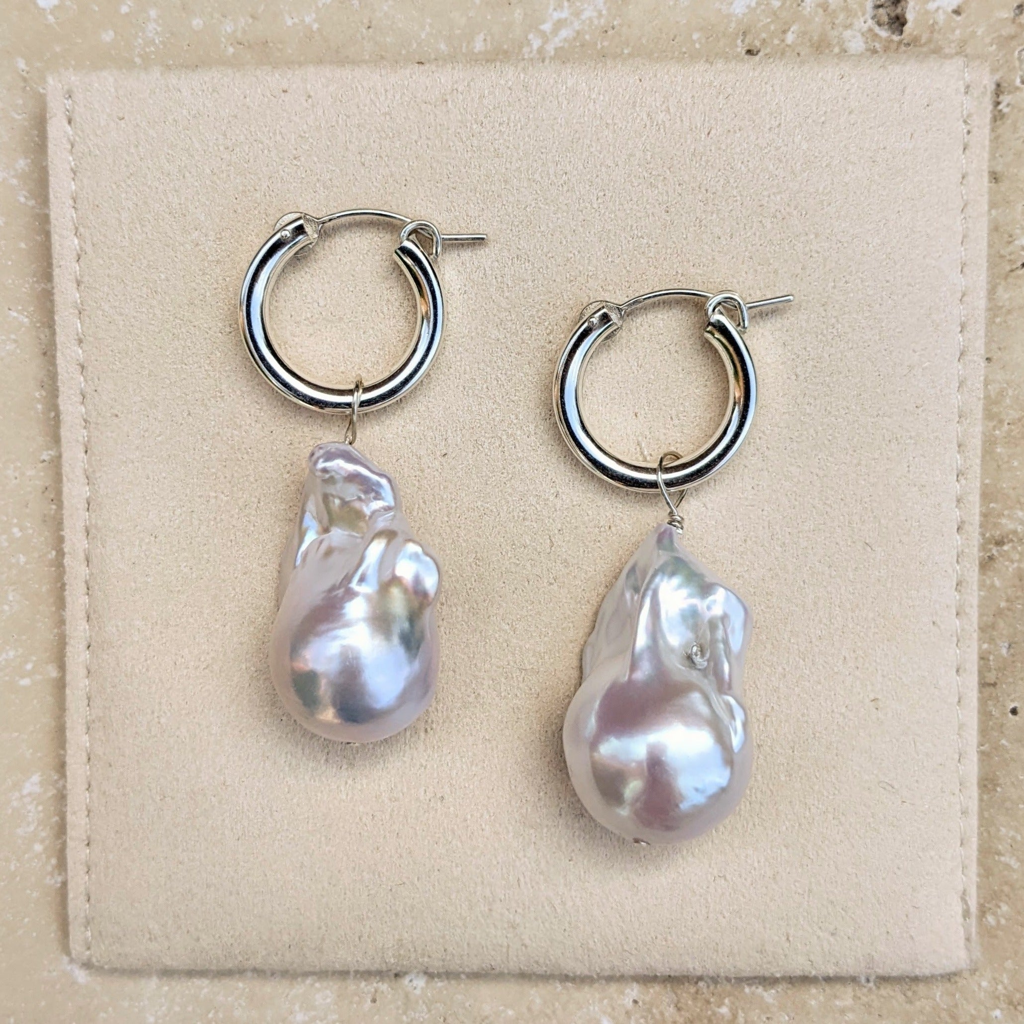 Large sterling silver hoop earrings with large baroque pearls