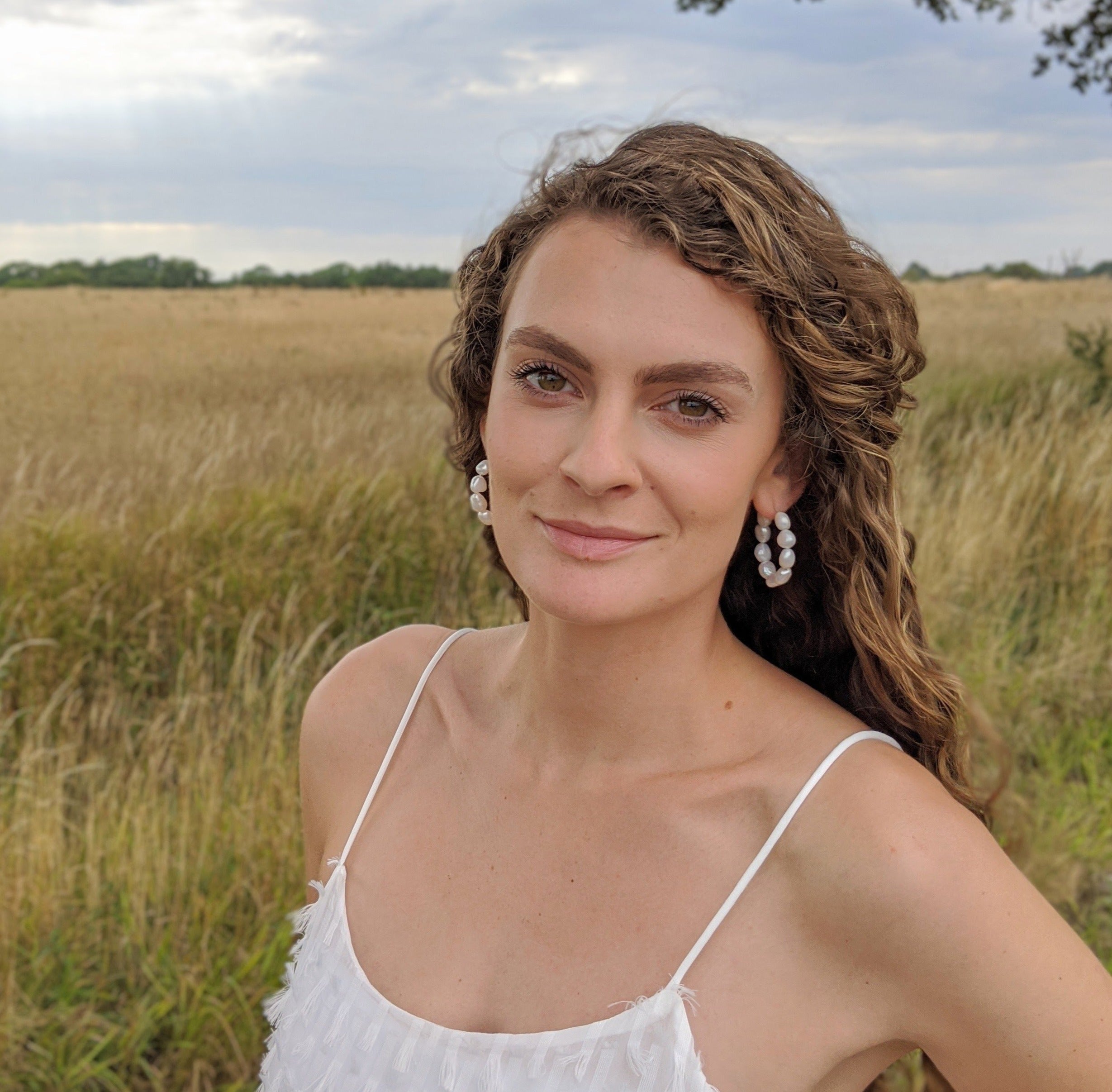 hoop earrings with nine 9mm baroque freshwater pearls model front