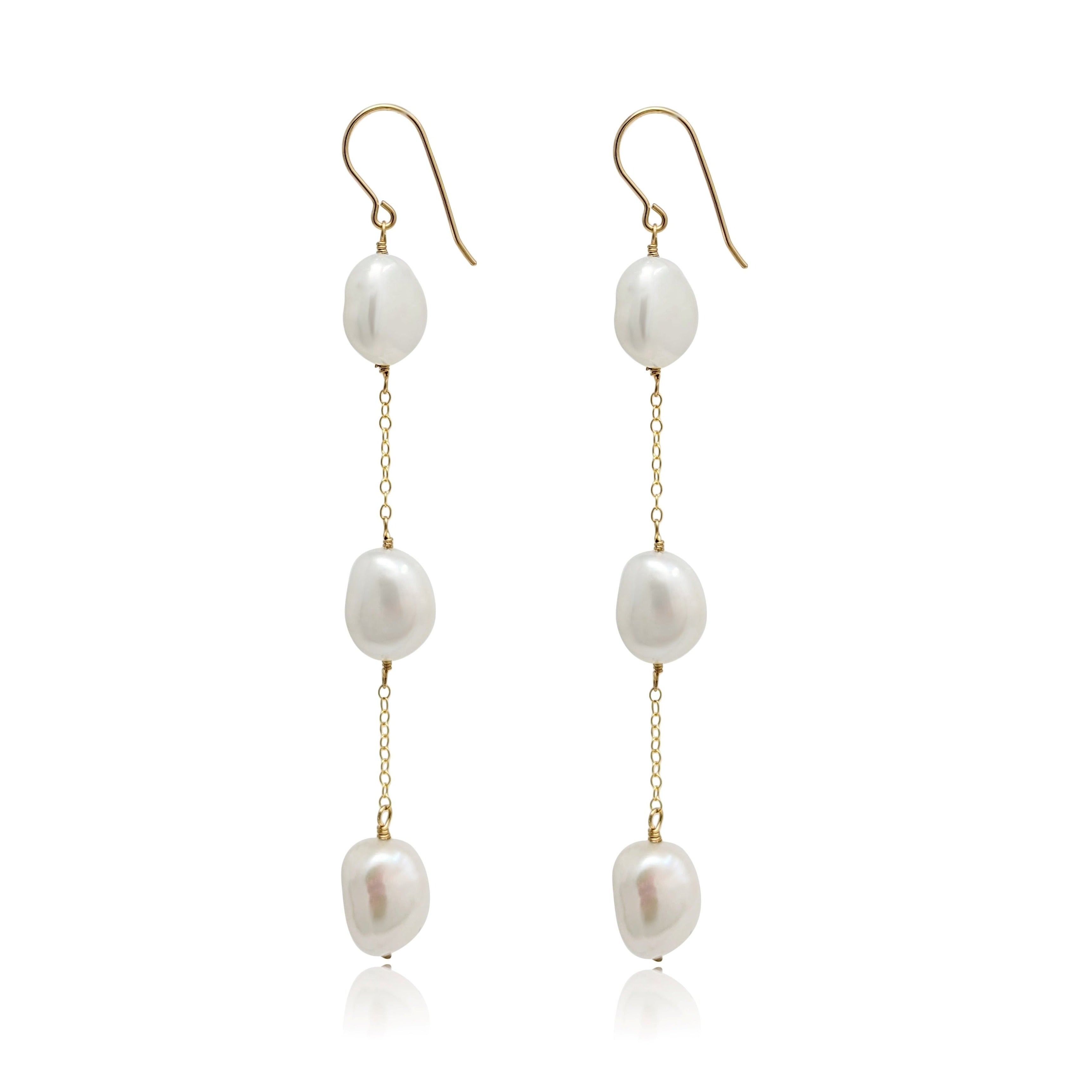 Long drop earrings with large trio of baroque pearls