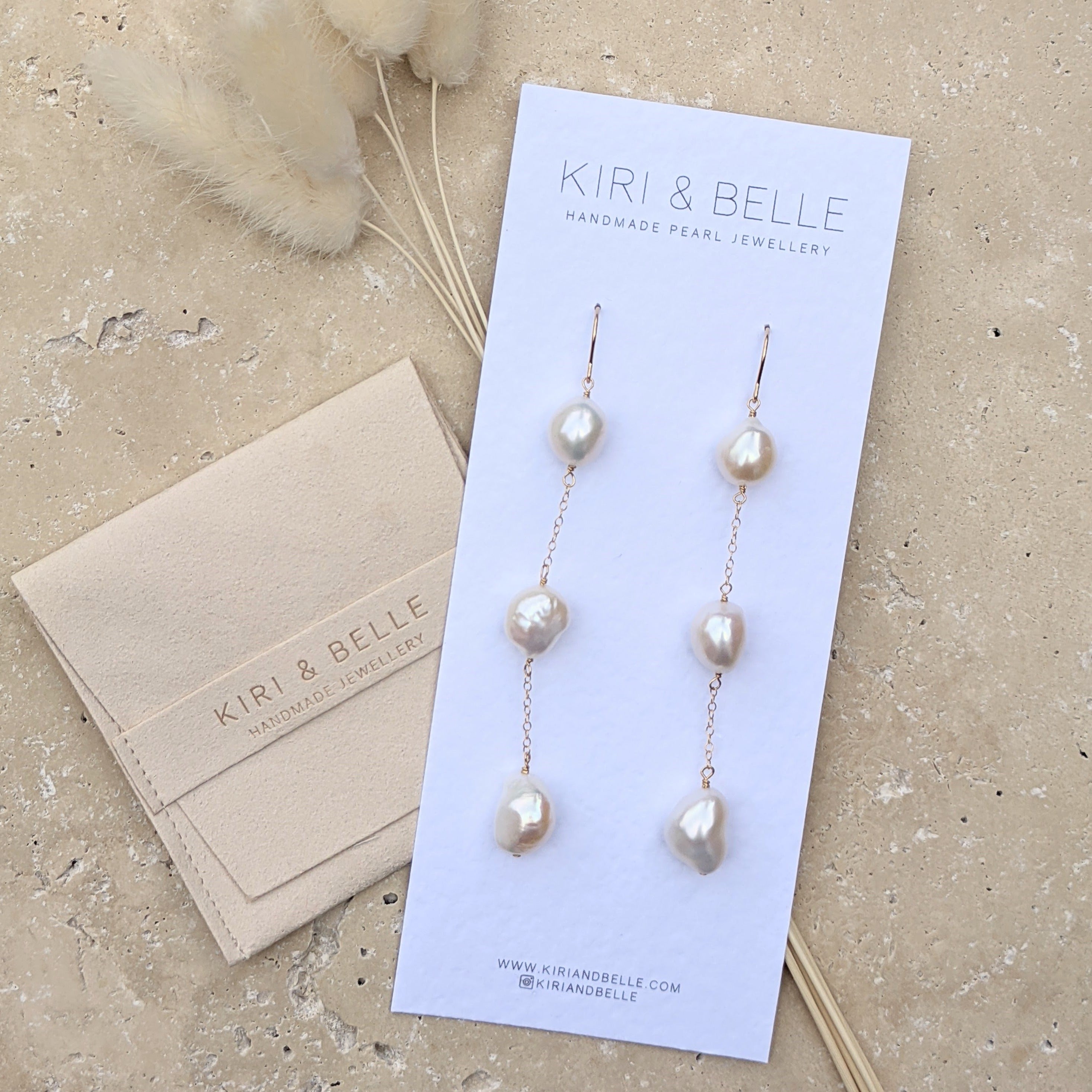 Long drop pearl gold earrings