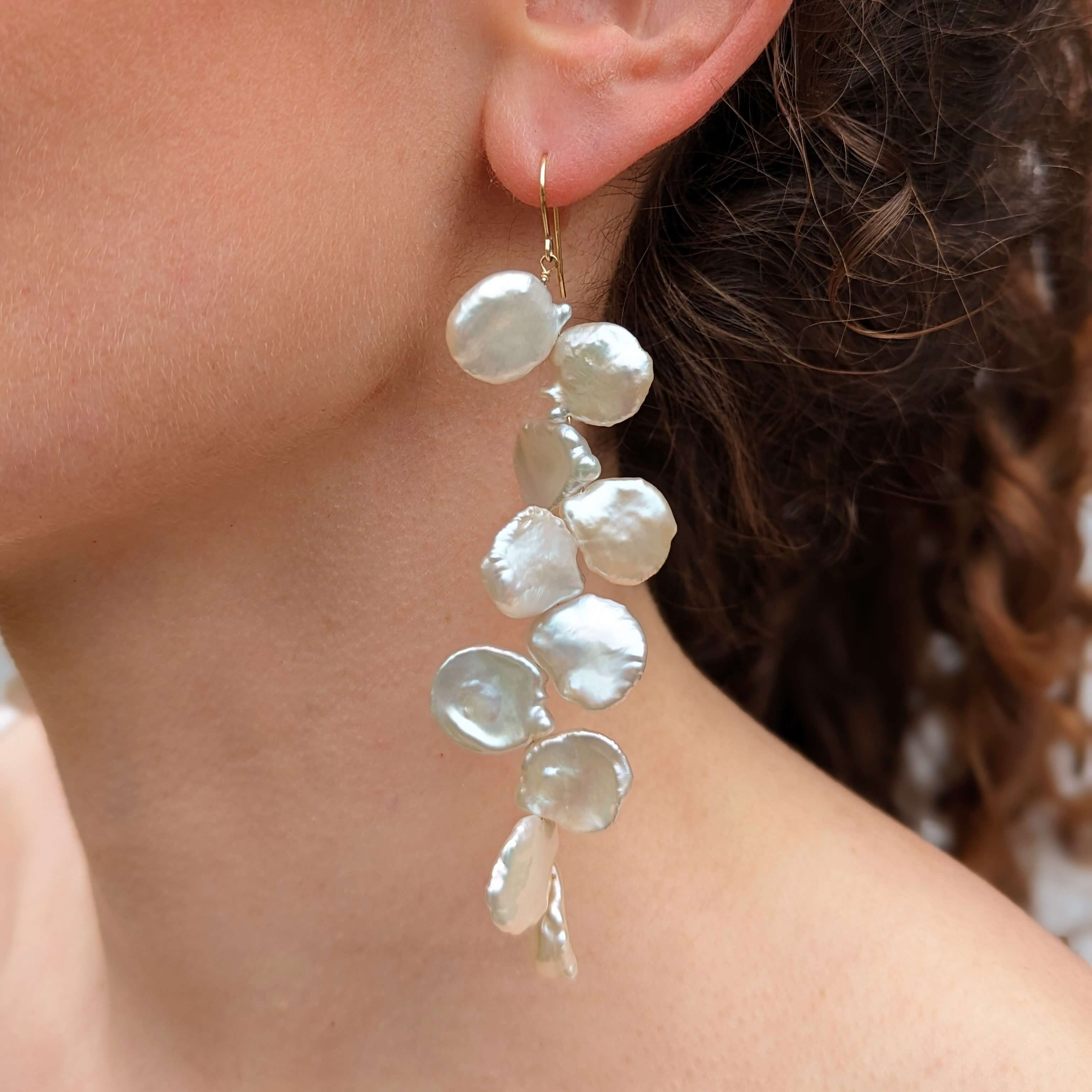 Model wearing long keshi pearl earrings