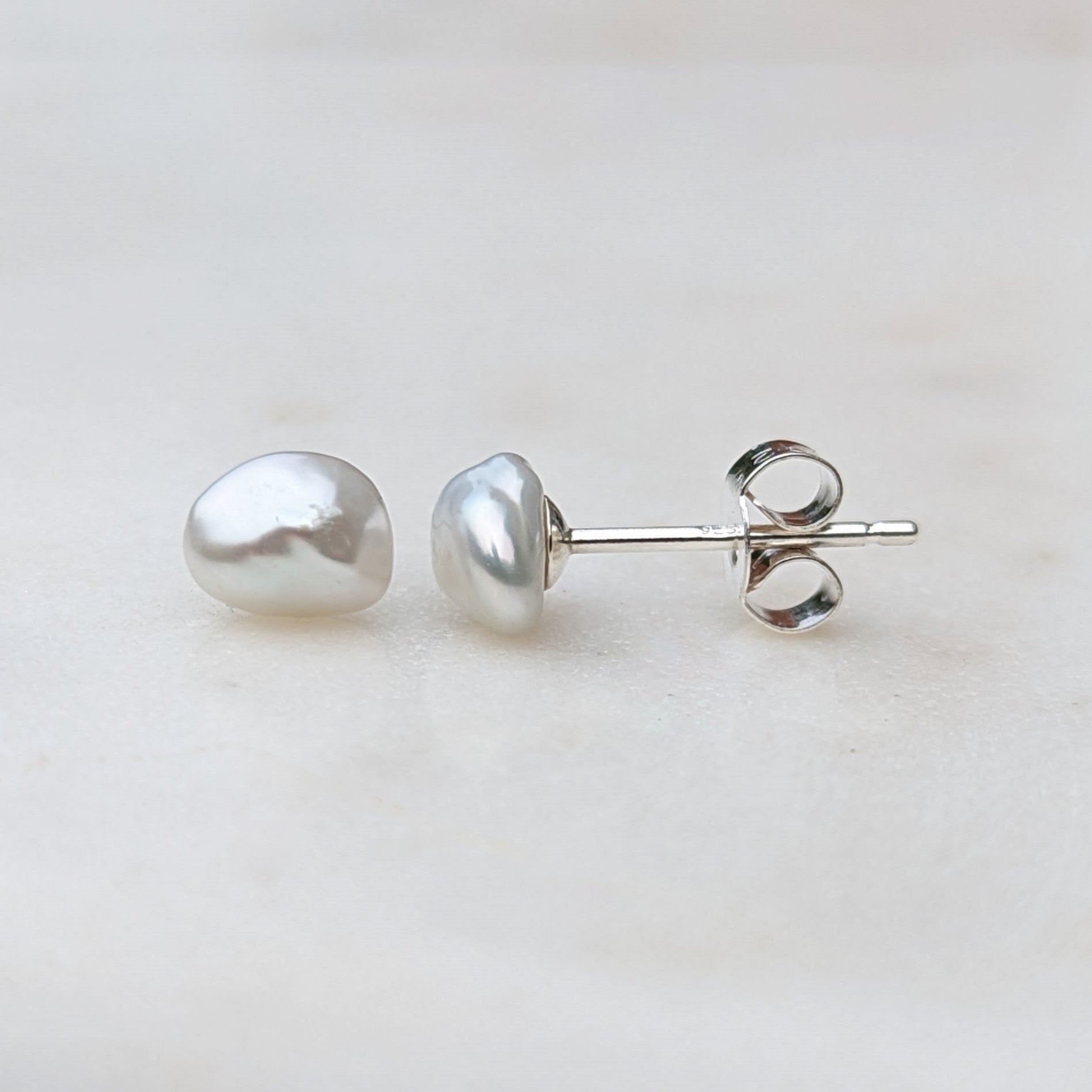 Small irregular shaped keshi pearl stud earrings in silver