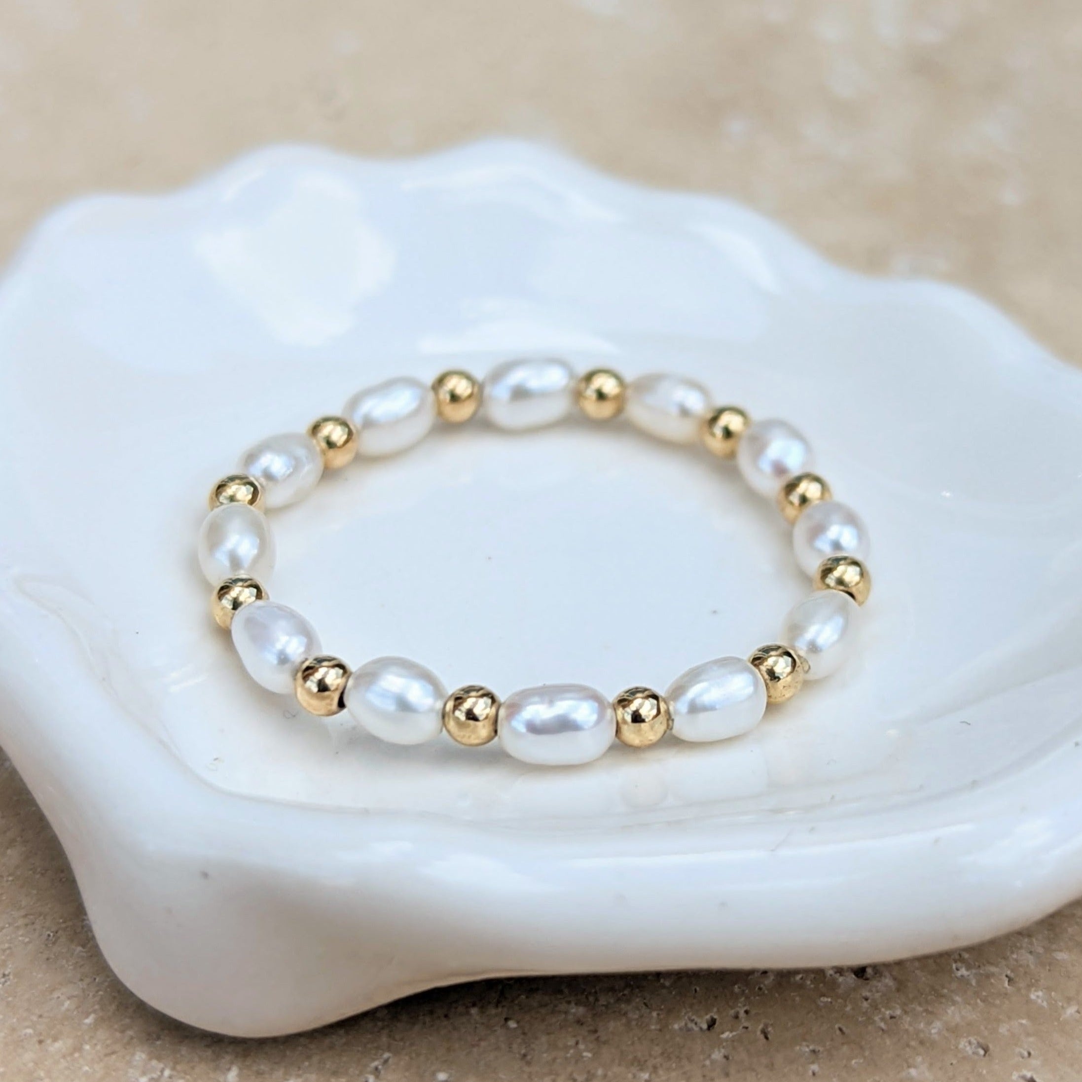 Pearl and gold bead ring