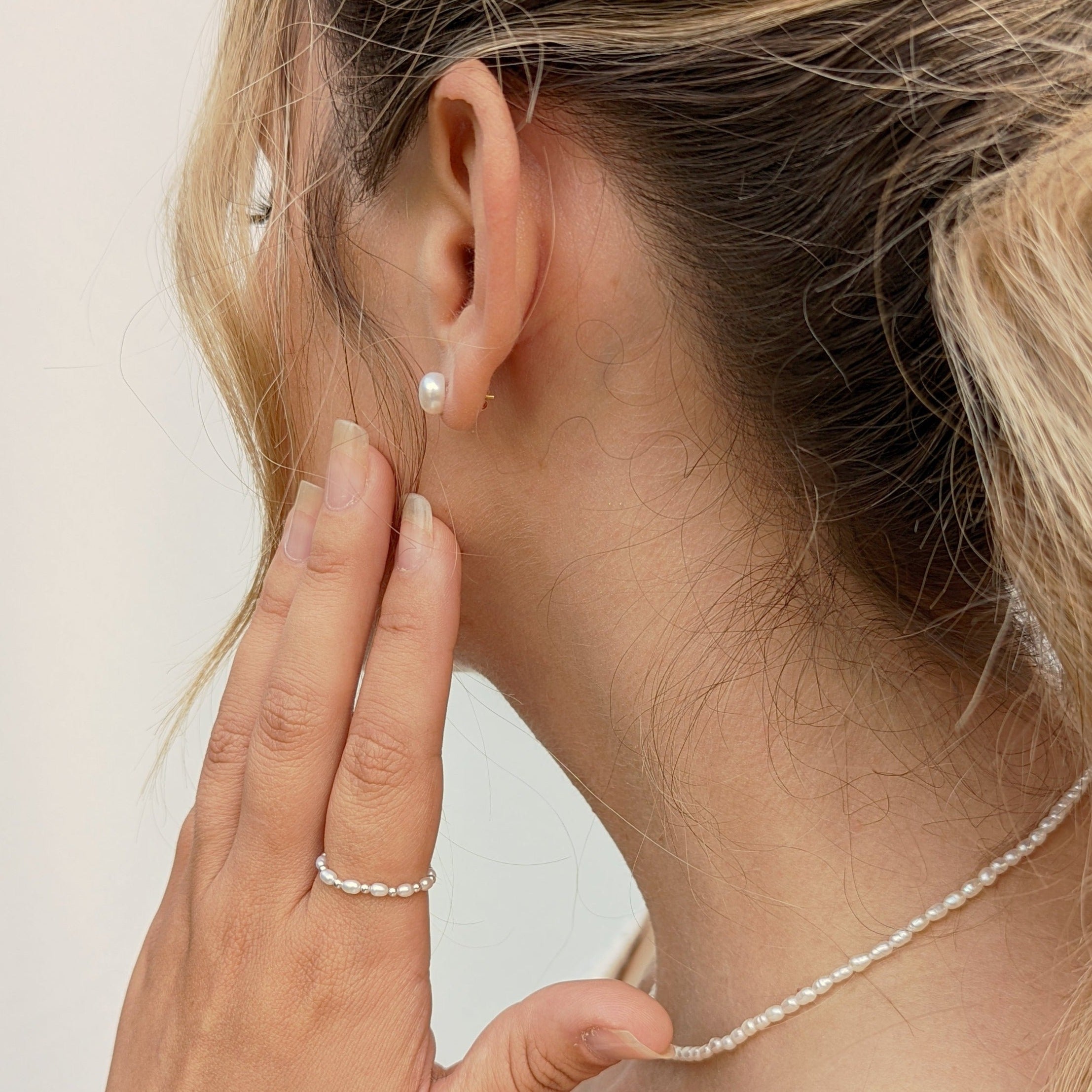 Model wearing pearl jewellery