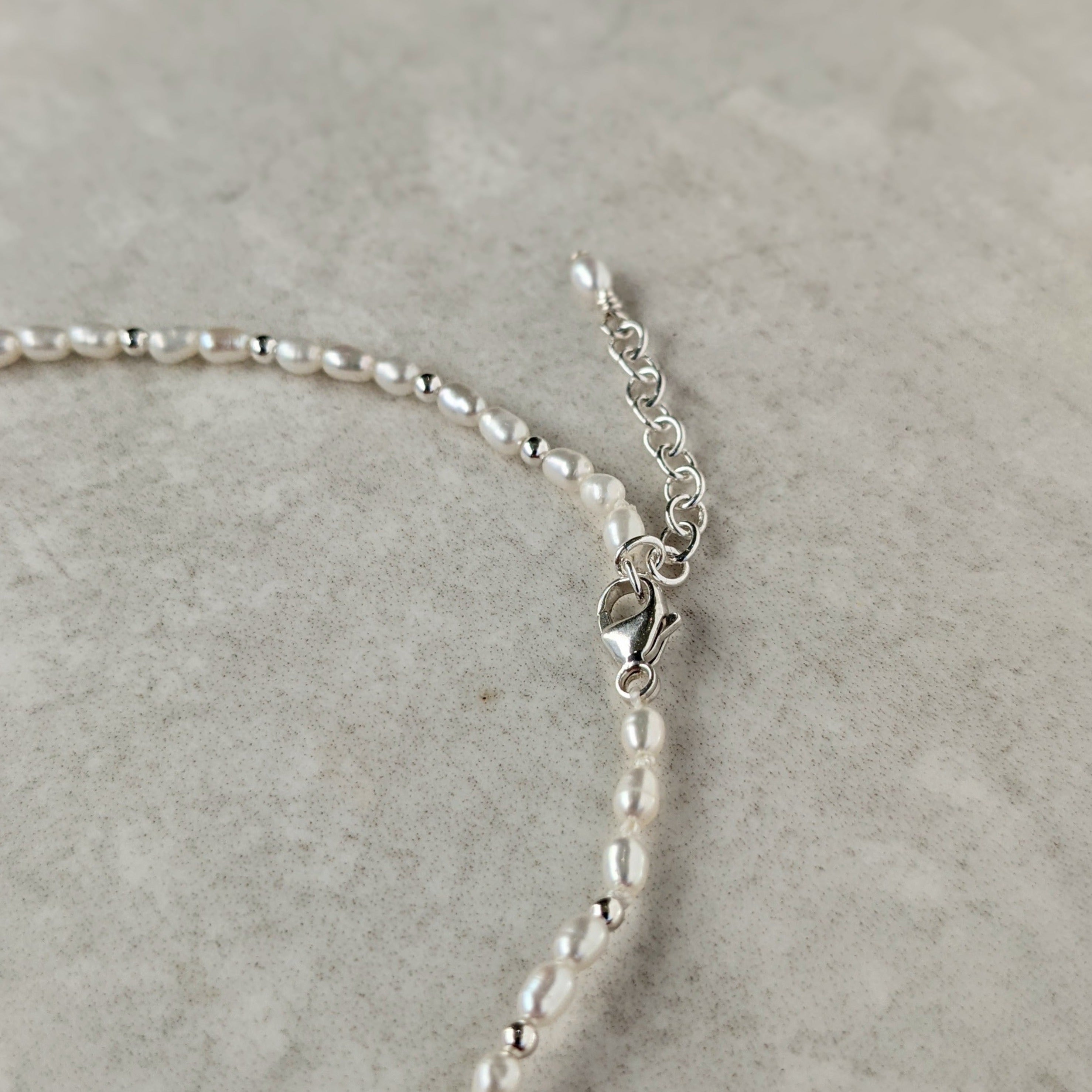 Sterling silver clasp on beaded pearl anklet 
