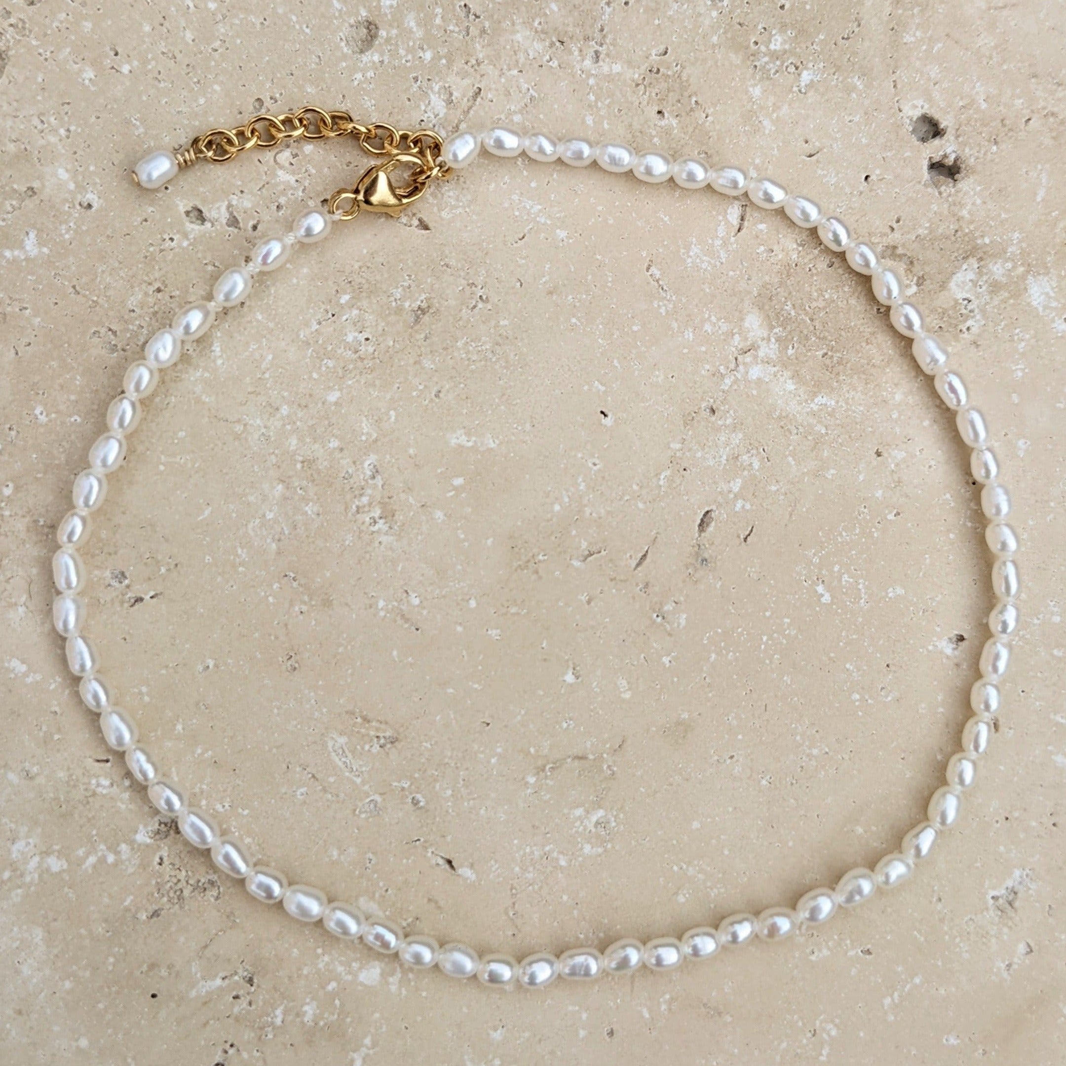 Freshwater seed pearl anklet with a gold adjustable clasp