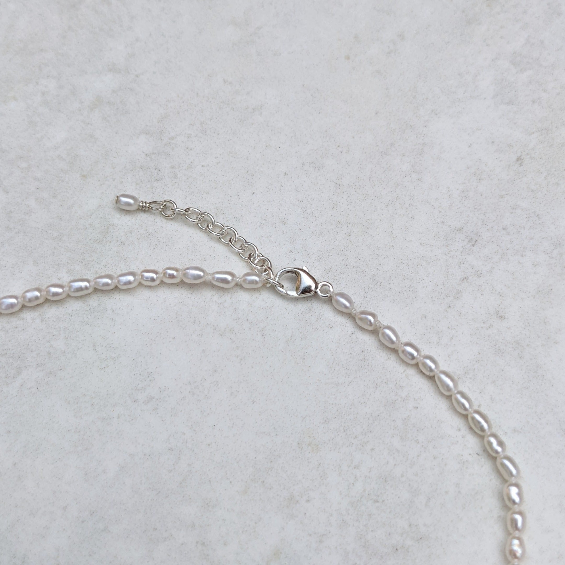 Sterling silver adjustable clasp on seed pearl necklace