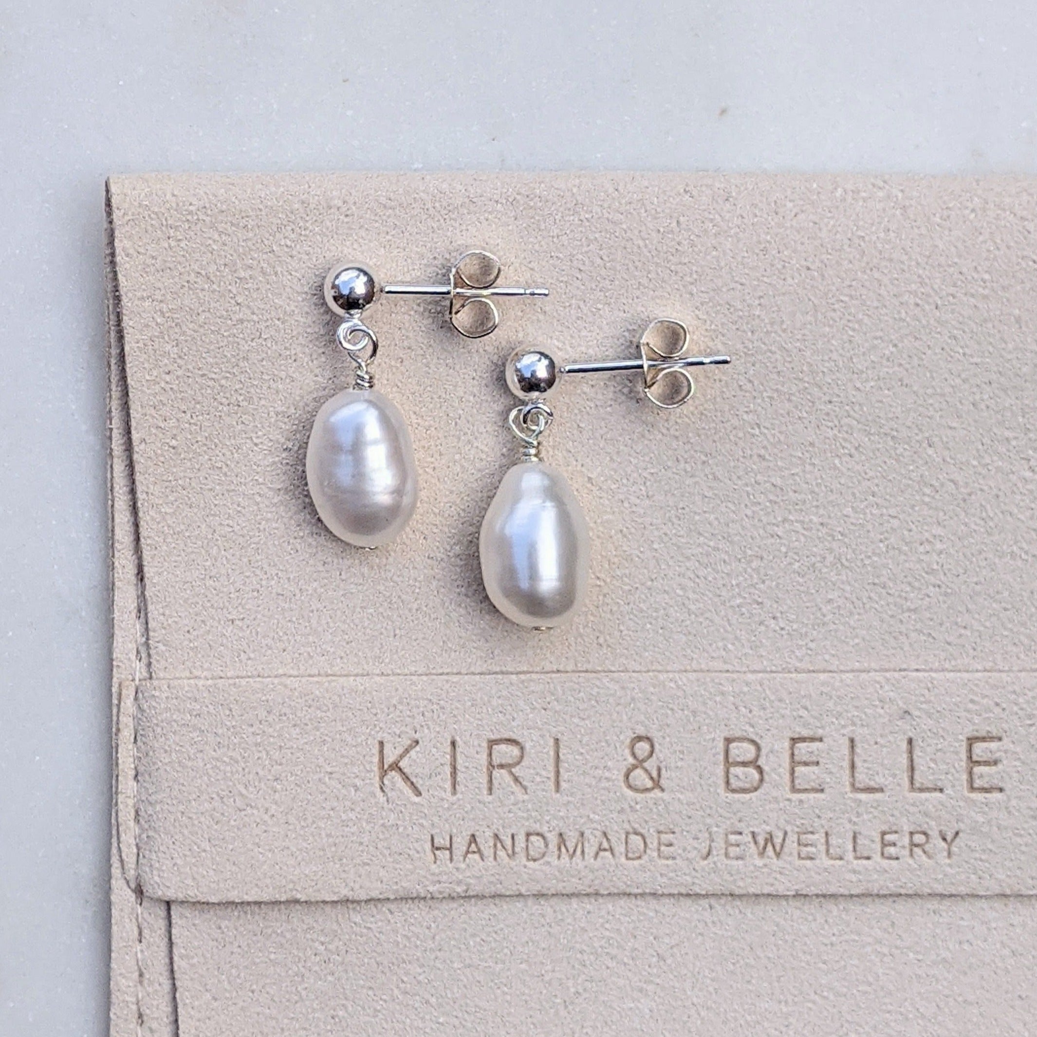 Silver balls stud single pearl drop earrings