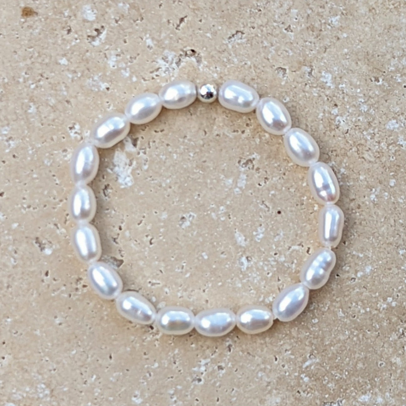 Tiny pearl ring with single silver bead