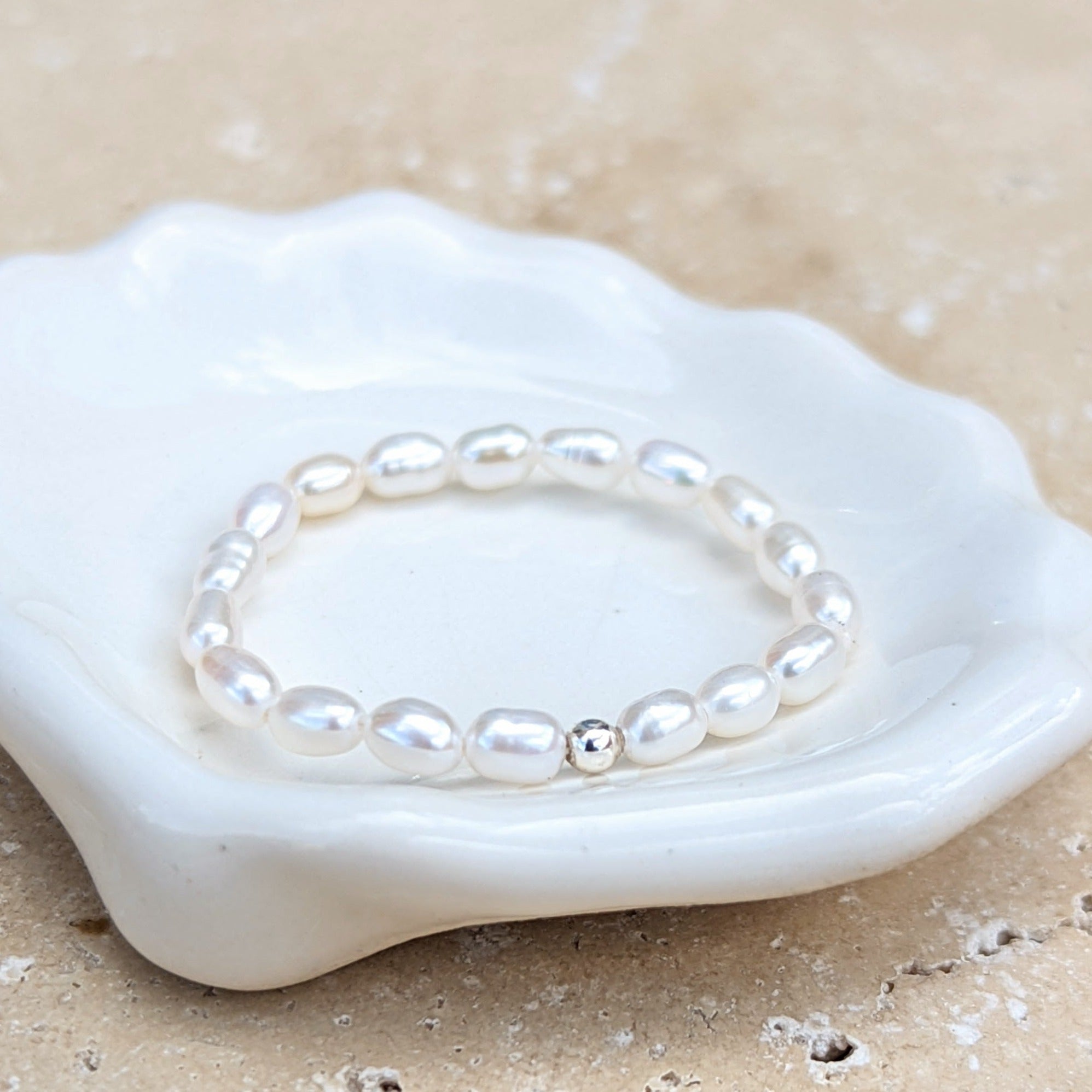 pearl ring with a single silver bead