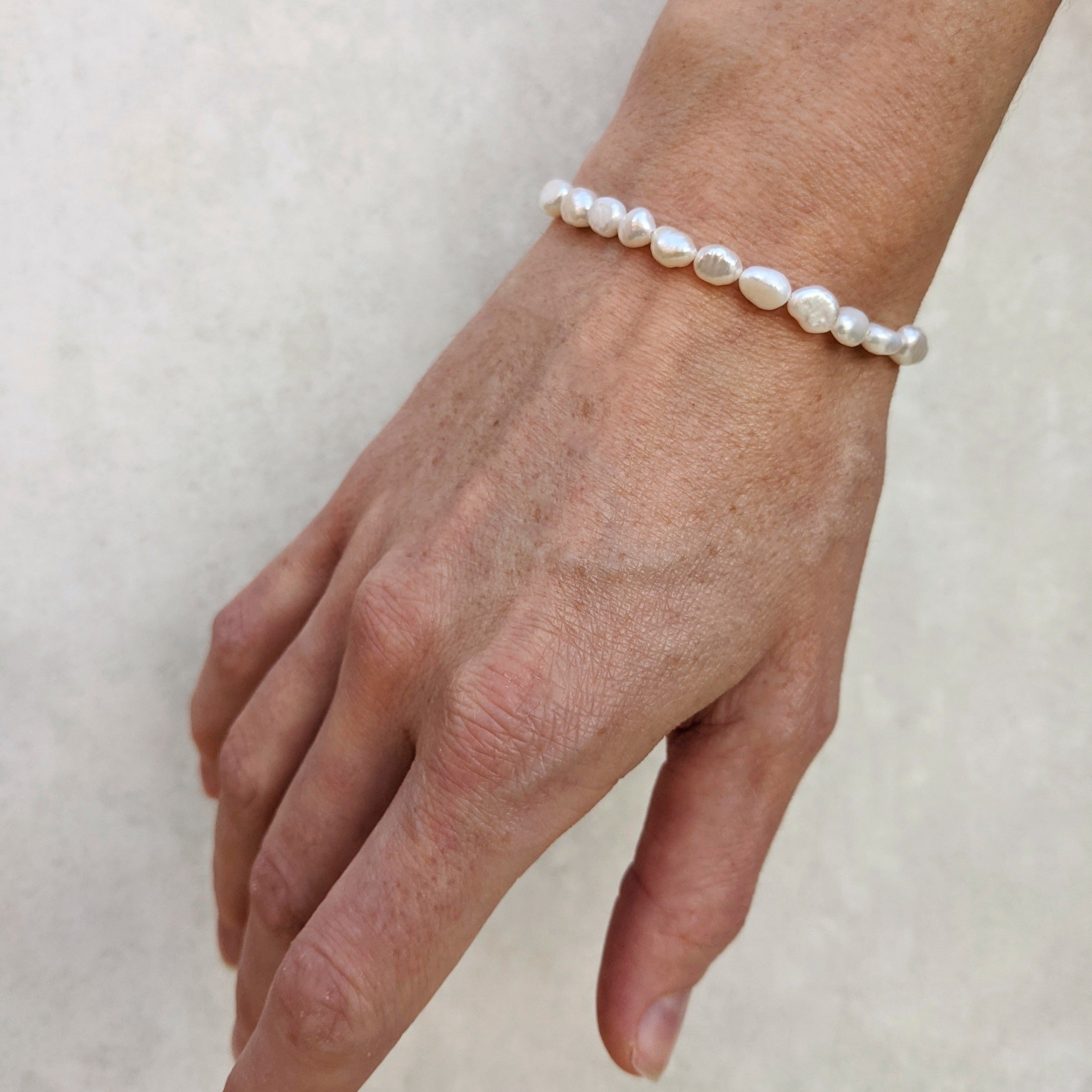Small baroque pearl bracelet irregular handmade gift on model right