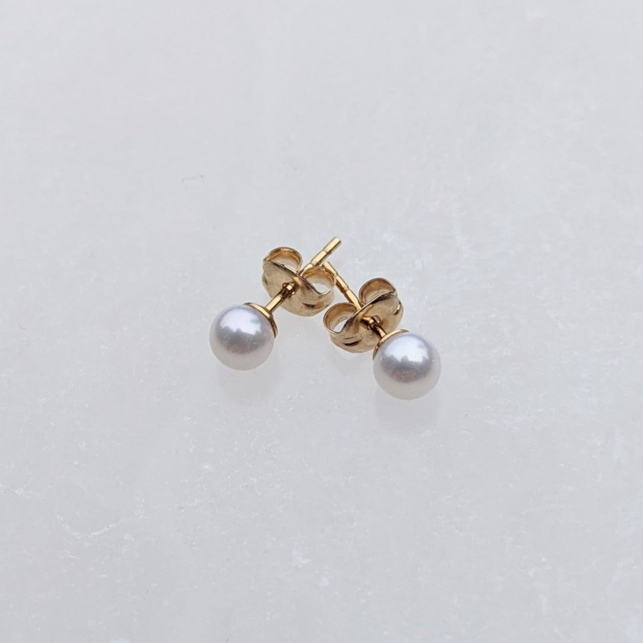 Small round pearl stud earrings
