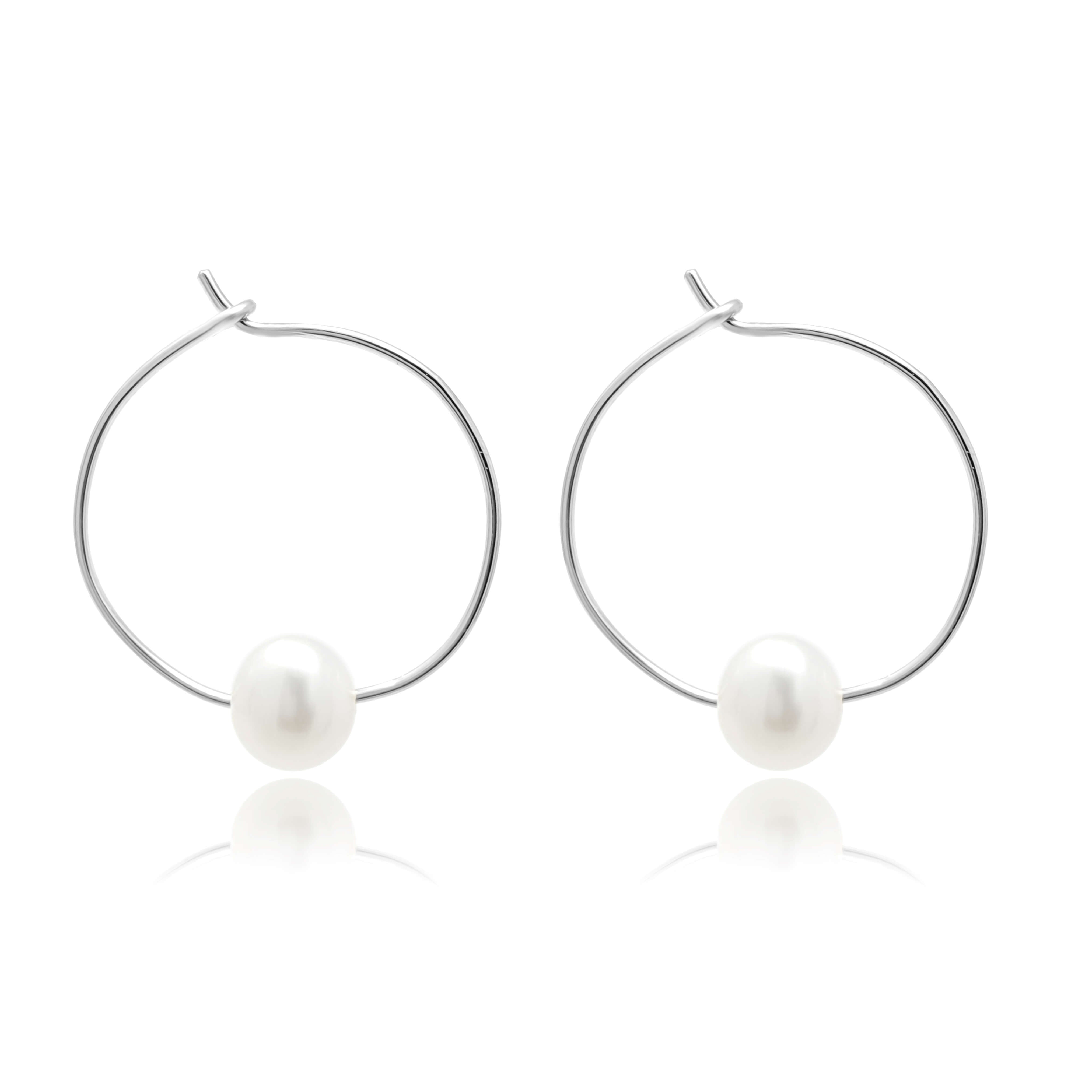 hoop pearl earrings white background in sterling silver